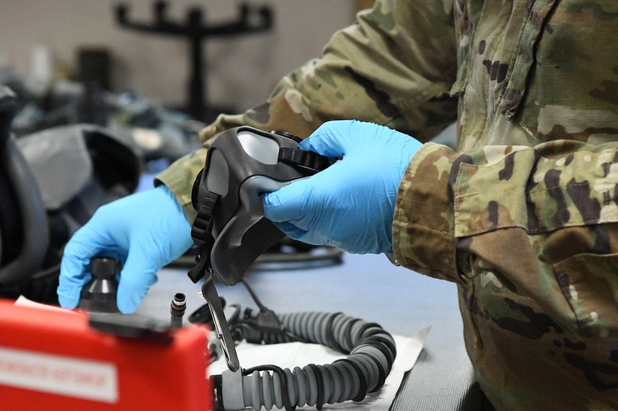Tech. Sgt. Derrick Eldridge, 301st Fighter Wing Aircrew Flight Equipment non-commissioned officer in charge, maintains an F-16 Fighting Falcon pilot helmet's oxygen mask insert at U.S. Naval Air Station Joint Reserve Base Fort Worth, Texas, Sept. 29, 2021. Besides maintaining routine flight equipment inspections, AFE also conducts water survival training every three years where pilots training for various scenarios should the have to eject from their aircraft. (U.S. photo Air Force by Staff. Sgt. Nije Hightower)