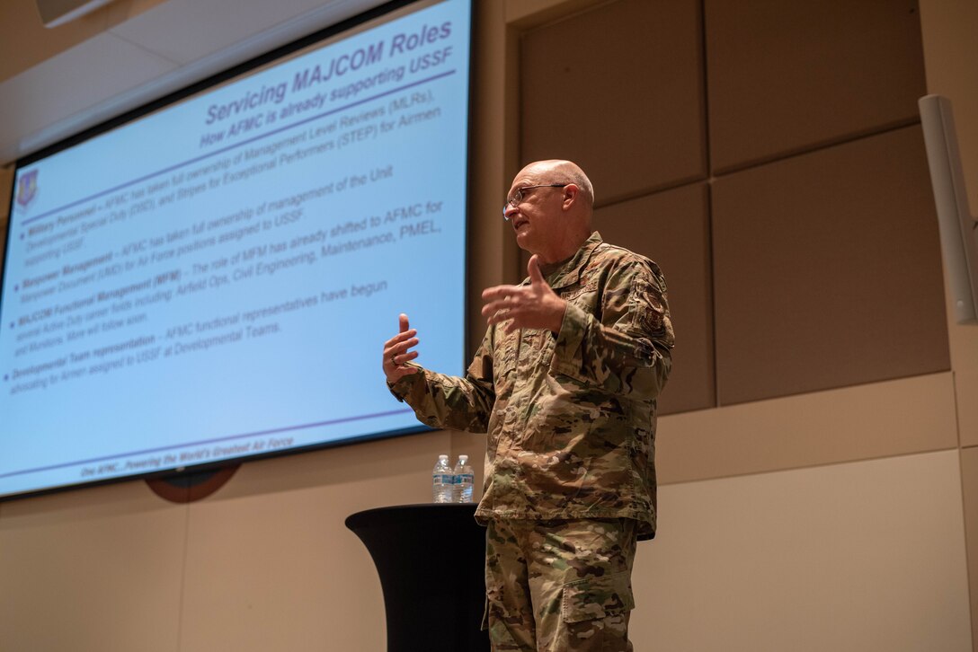 Gen.l Arnold W. Bunch, Jr.,  Air Force Materiel Command commander, speaks to Airmen in regards to support they will be providing to Airmen supporting the U.S. Space Force during a town hall at Buckley Space Force, Colo., Oct. 28, 2021. Approximately 8,000 Airmen assigned to Space Force installations and units will eventually be serviced by Air Force Materiel Command. (U.S. Space Force photo by Airman 1st Class Shaun Combs)