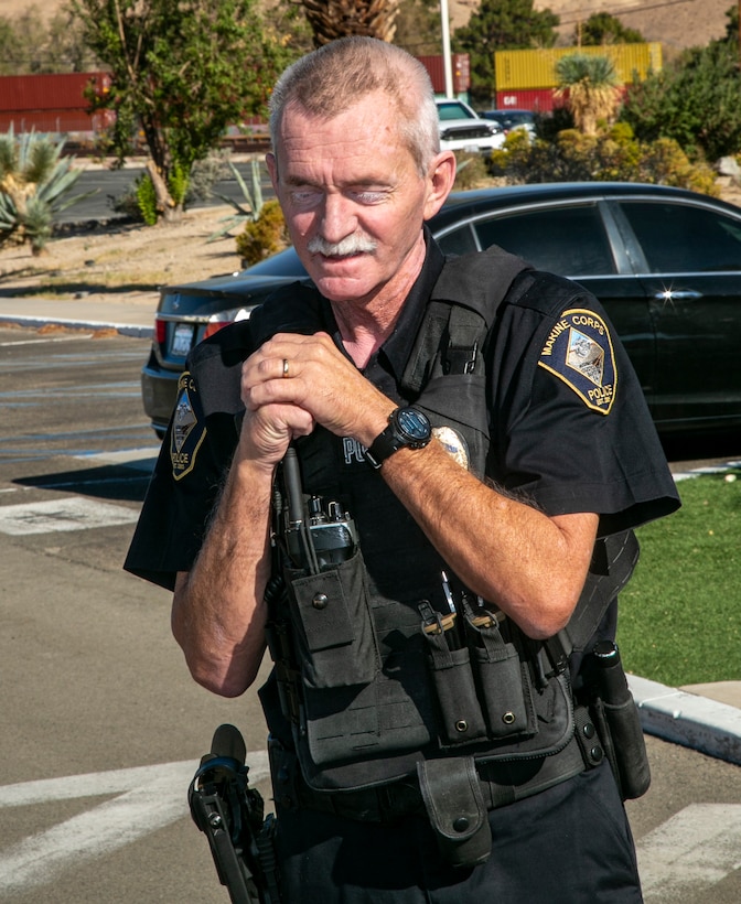 Officer Stephen Martin, with Marine Corps Police Department, takes a moment to thank Fire and Emergency Services personnel for saving his life during a Lifesaving Award presentation aboard Marine Corps Logistics Base Barstow Oct. 15, 2021.