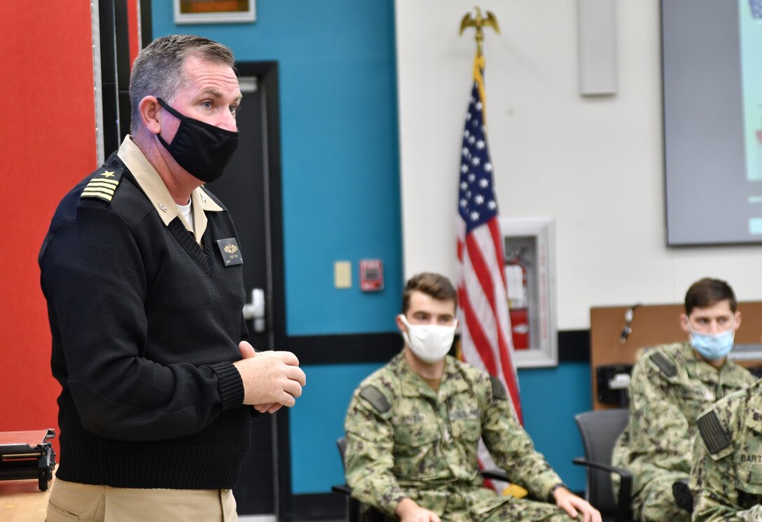 IMAGE: Capt. Stephen “Casey” Plew, commanding officer of Naval Surface Warfare Center Dahlgren Division (NSWCDD), speaks to midshipmen from the United States Naval Academy during a visit to the installation. The future naval officers received tours of many of the facilities at NSWCDD.