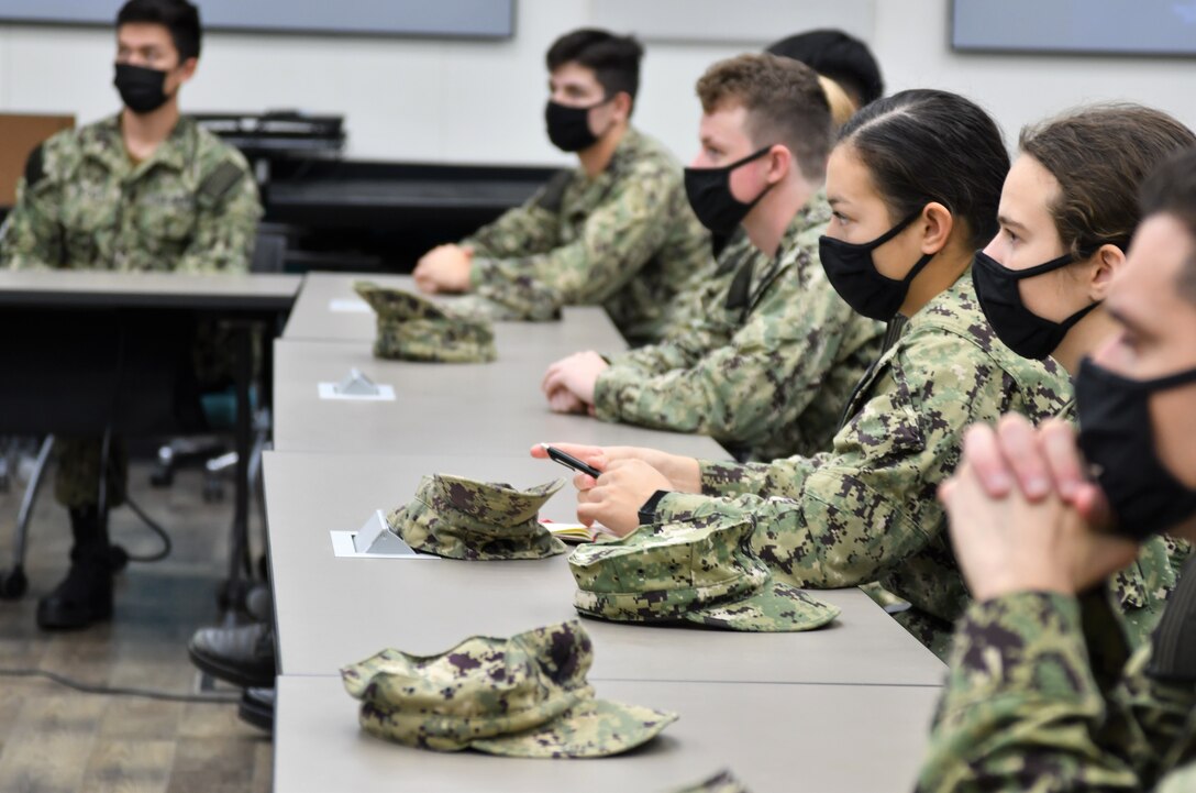 IMAGE: Midshipmen from the United States Naval Academy listen to a briefing in the Innovation Lab at Naval Surface Warfare Center Dahlgren Division (NSWCDD) during a visit to the installation. The future naval officers received tours of many of the facilities at NSWCDD.