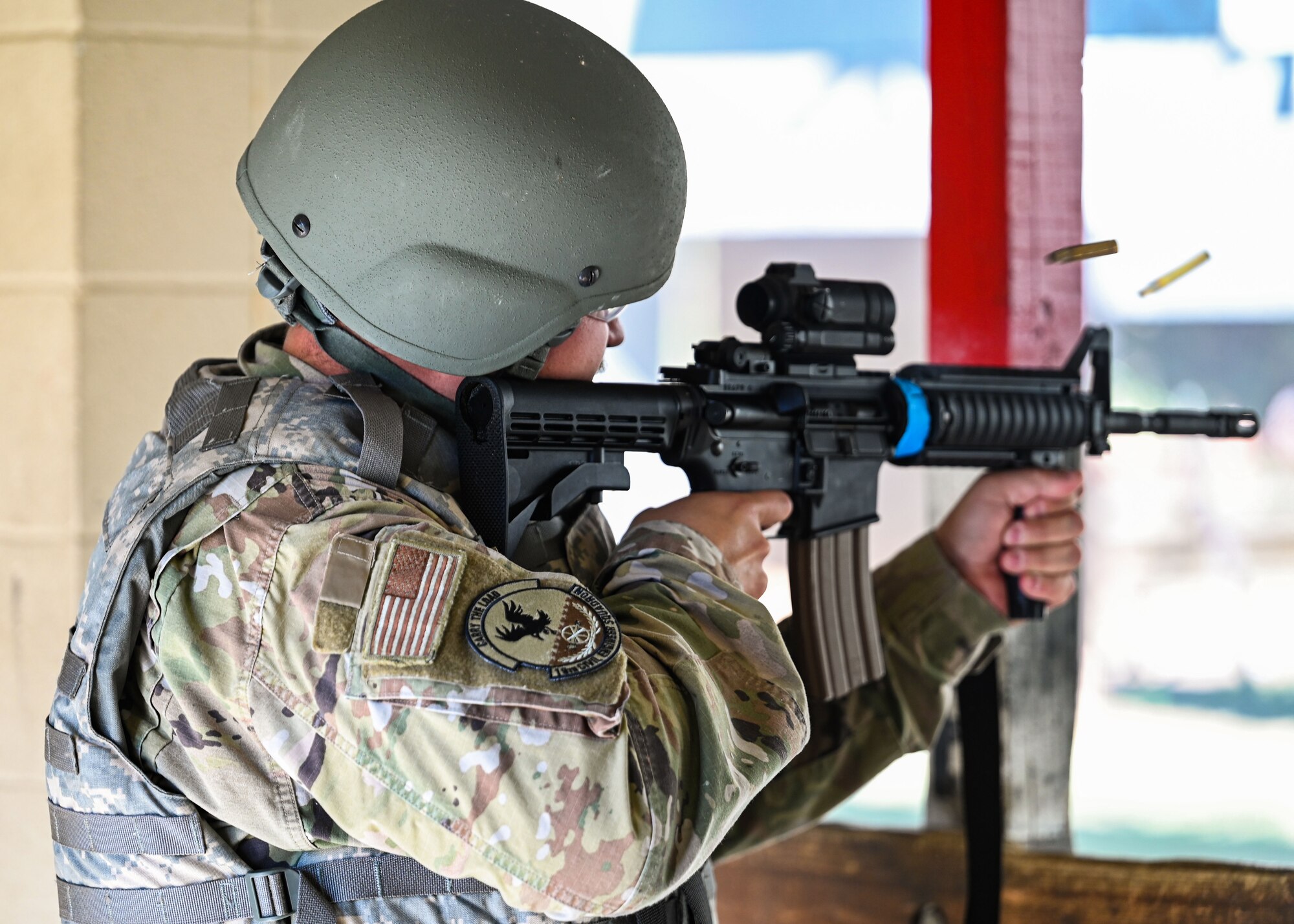 An Airman fires an M-4