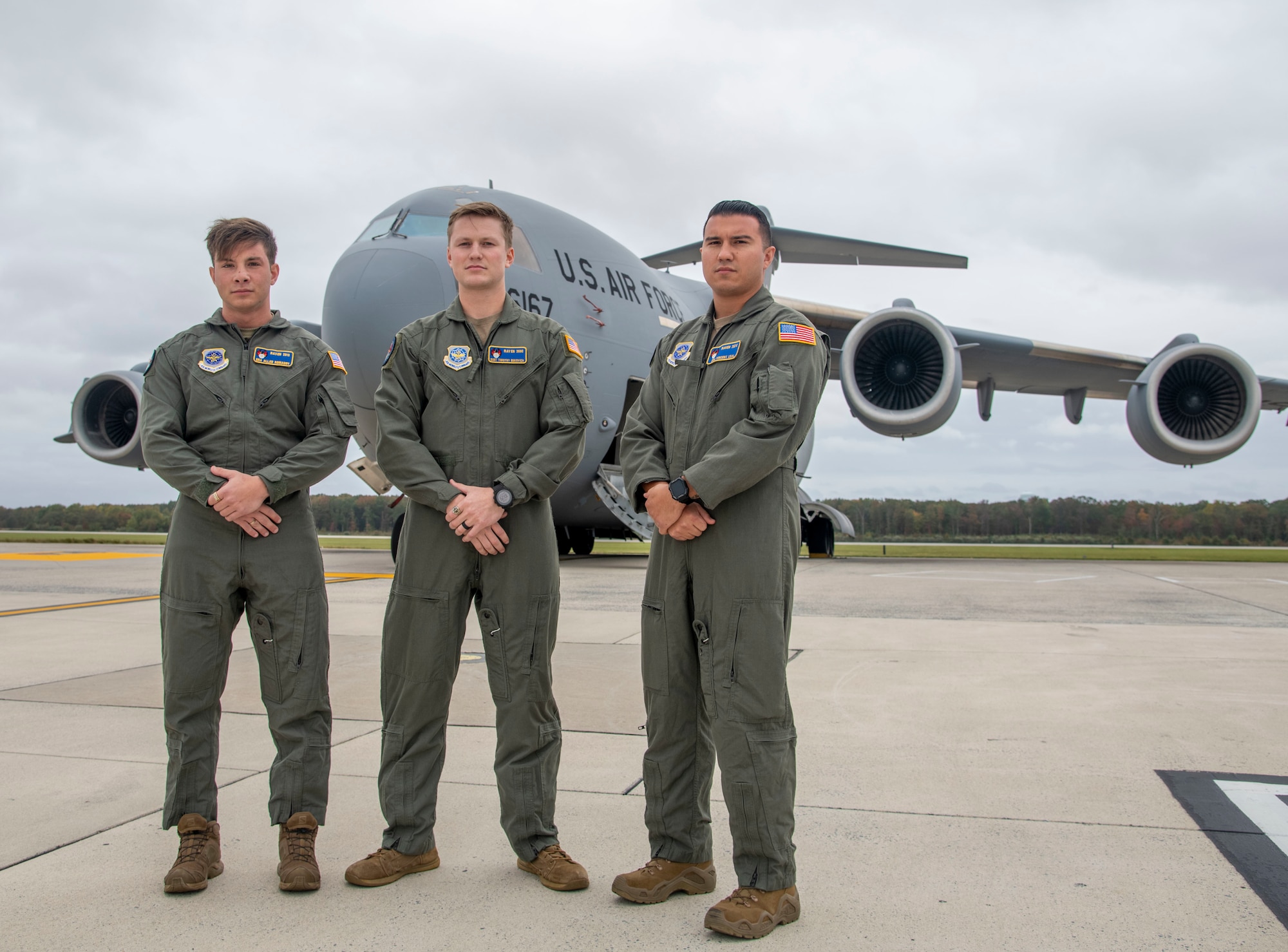 From the left, Senior Airman Allan Romanov, Staff Sgt. Timothy Bukovich and Senior Airman Vincent Leal, all 436th Security Forces Squadron Phoenix Raven team members, stand in front of a C-17 Globemaster III at Dover Air Force Base, Delaware, Oct. 29, 2021. The Ravens provided security to Air Mobility Command assets during Operation Allies Refuge, the largest non-combatant evacuation operation airlift in U.S. history, evacuating more than 124,000 people from Hamid Karazai International Airport, in Kabul, Afghanistan. (U.S. Air Force photo by Tech. Sgt. Nicole Leidholm)