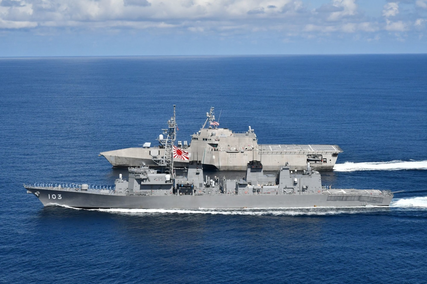 Independence-variant littoral combat ship USS Jackson (LCS 6), top, and Japan Maritime Self-Defense Force Murasame-class destroyer JS Yudachi (DD 103) sail together in the South China Sea. Jackson, part of Destroyer Squadron Seven, are on a rotational deployment in the U.S. 7th Fleet area of operation to enhance interoperability with partners and serve as a ready-response force in support of a free and open Indo-Pacific region.