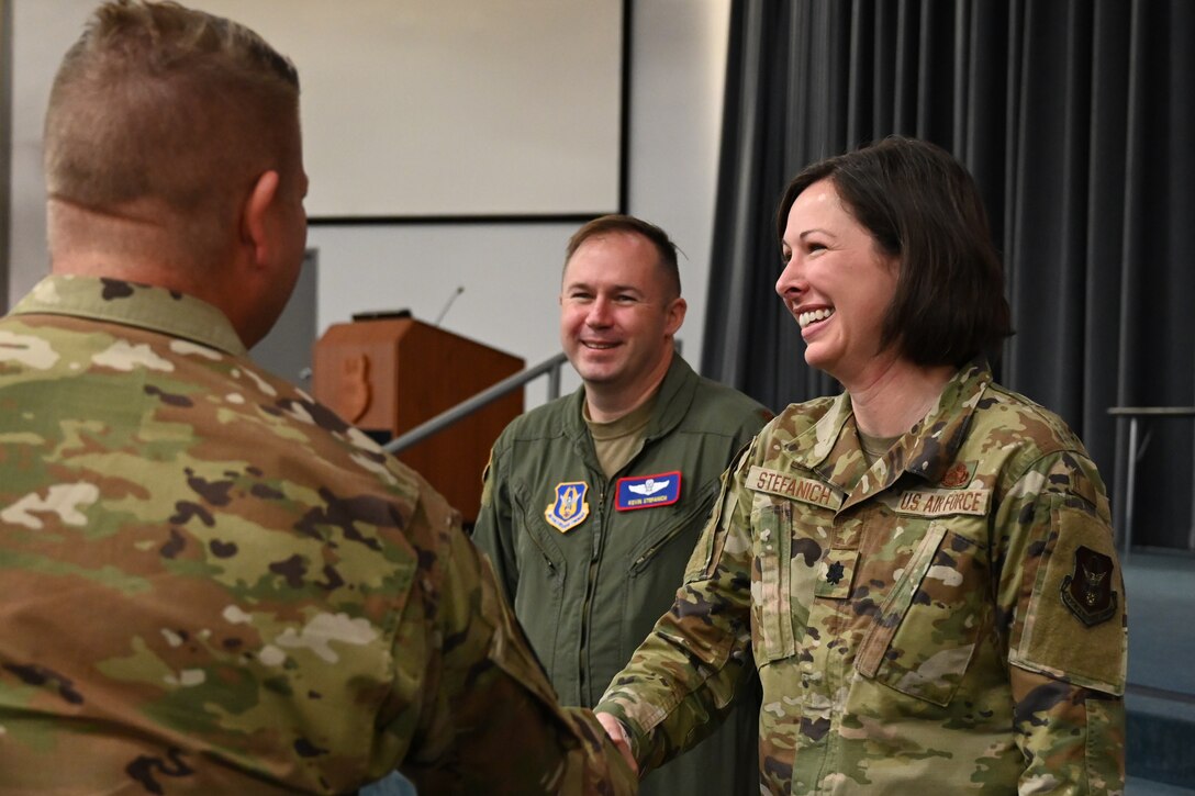 Photo of Airmen shaking hands.