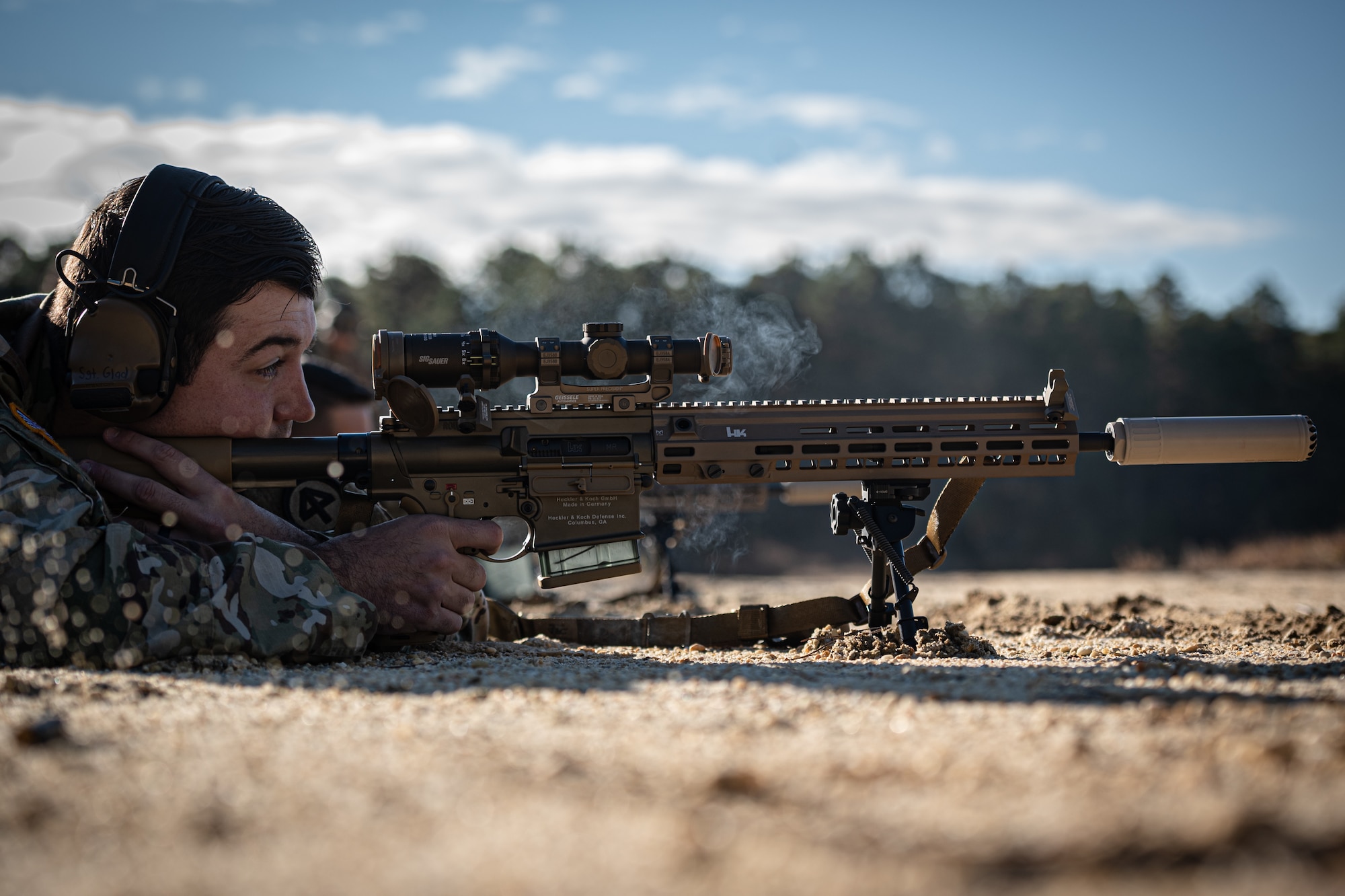 Soldier fires a rifle