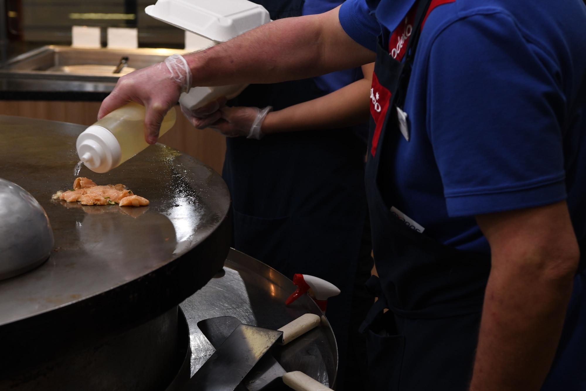 Tony Selk, a retired Air Force member, prepares burritos at the Chadwell Dining Facility Jan. 29, 2021, on F. E. Warren Air Force Base, Wyoming. Selk retired from the Navy and the Air Force and now spends his time cooking for his five grandchildren. (U.S. Air Force photo by Airman Faith MacIlvaine)