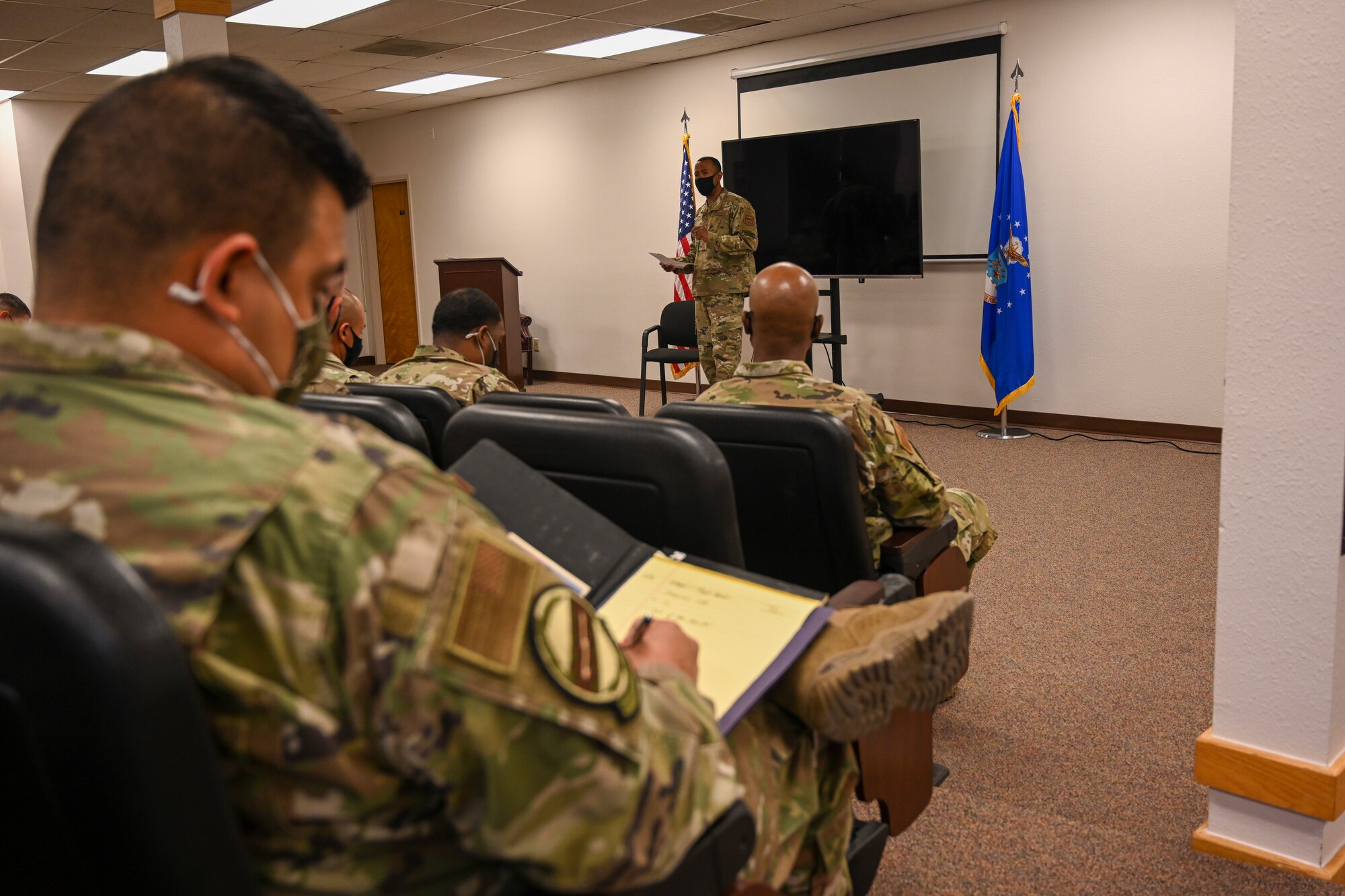 A senior enlisted member reviews a performance report at the Tech. Sgt. Records, Oct. 18, 2021, on Holloman Air Force Base, New Mexico. Technical sergeants broke out into groups with senior enlisted members to get direct feedback on their records. (U.S. Air Force photo by Airman 1st Class Adrian Salazar)