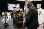 U.S. Army Gen. Laura J. Richardson, incoming commander of U.S. Southern Command, assumes command from U.S. Secretary of Defense Lloyd J. Austin during the SOUTHCOM change of command ceremony at SOUTHCOM Headquarters in Doral, Florida, Oct. 29, 2021.
