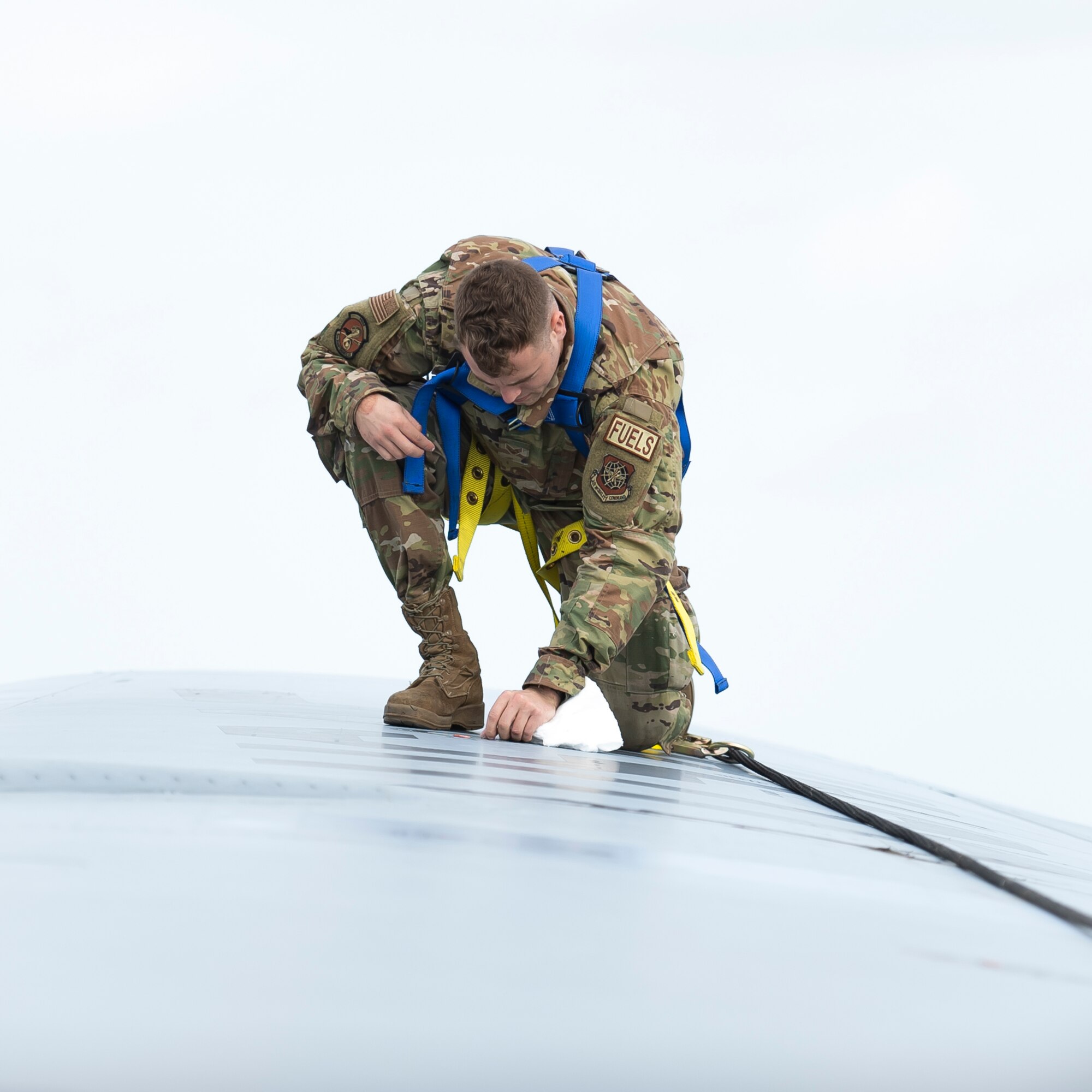 U.S. Air Force Senior Airman Brendon Kozicki, 6th Maintenance Squadron aircraft fuel systems specialist, completes a fuel leak evaluation on the wing of a KC-135 Stratotanker aircraft at MacDill Air Force Base, Florida, Oct. 29, 2021.