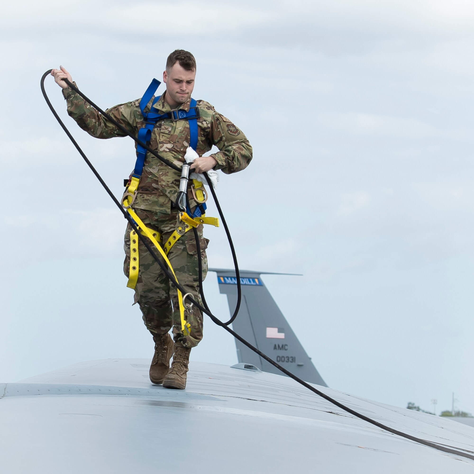 U.S. Air Force Senior Airman Brendon Kozicki, 6th Maintenance Squadron aircraft fuel systems specialist, completes a fuel leak evaluation on the wing of a KC-135 Stratotanker aircraft at MacDill Air Force Base, Florida, Oct. 29, 2021.