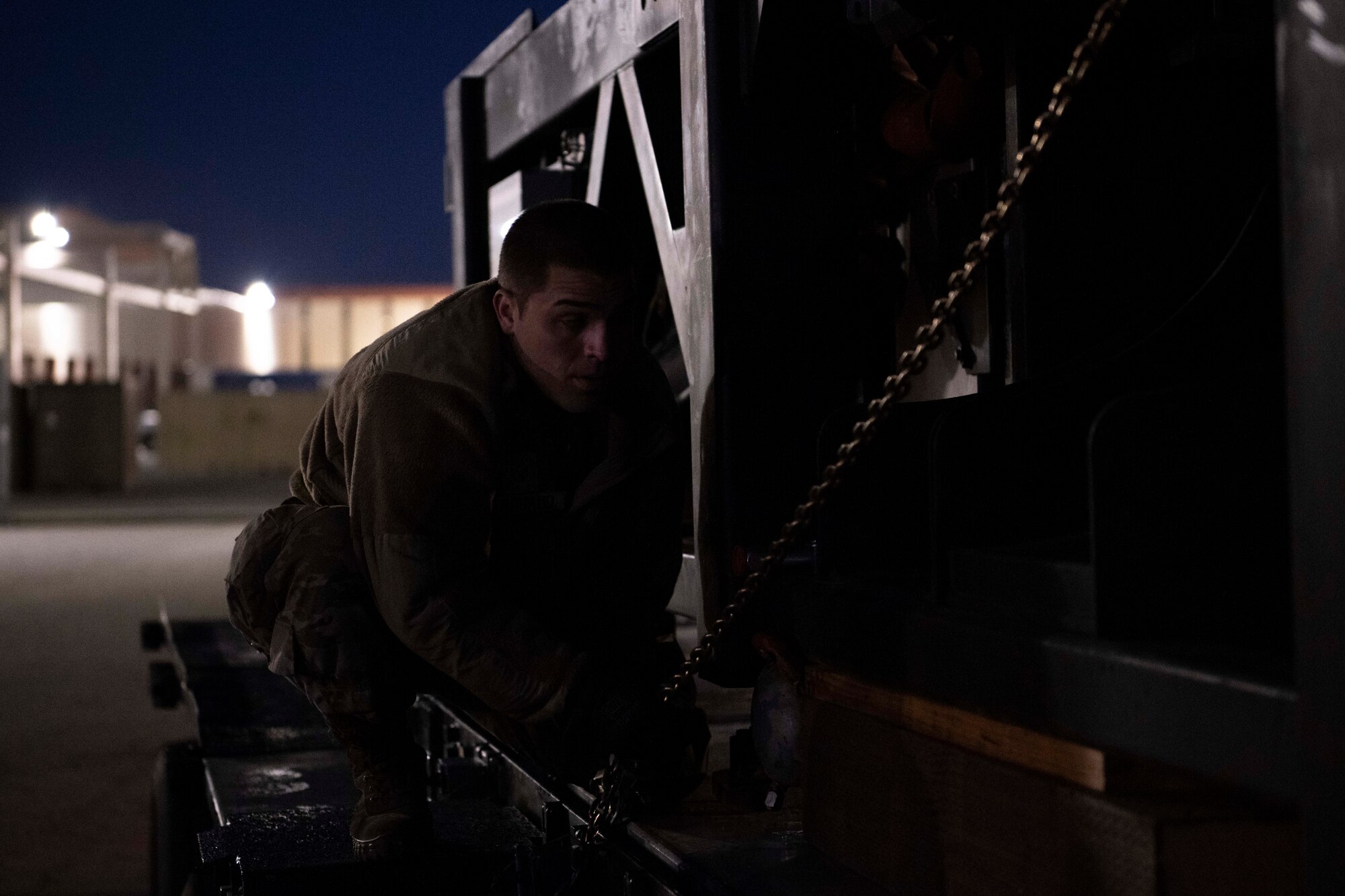 An Airman secures chain of cargo