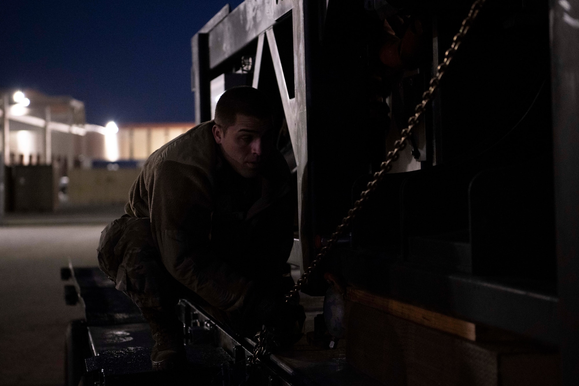 An Airman secures chain of cargo