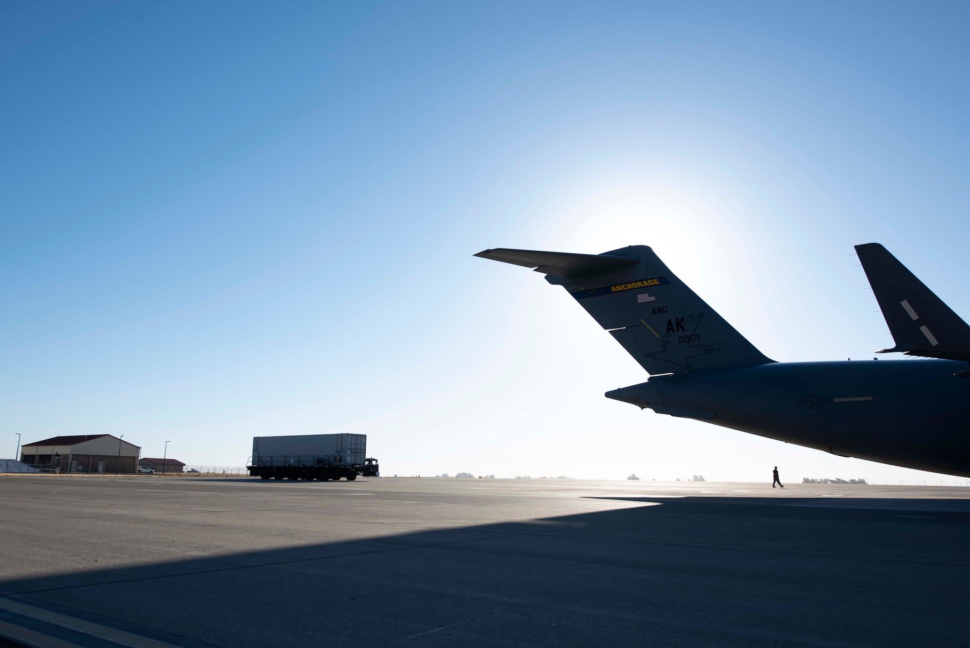 A vehicle drives up to a plane