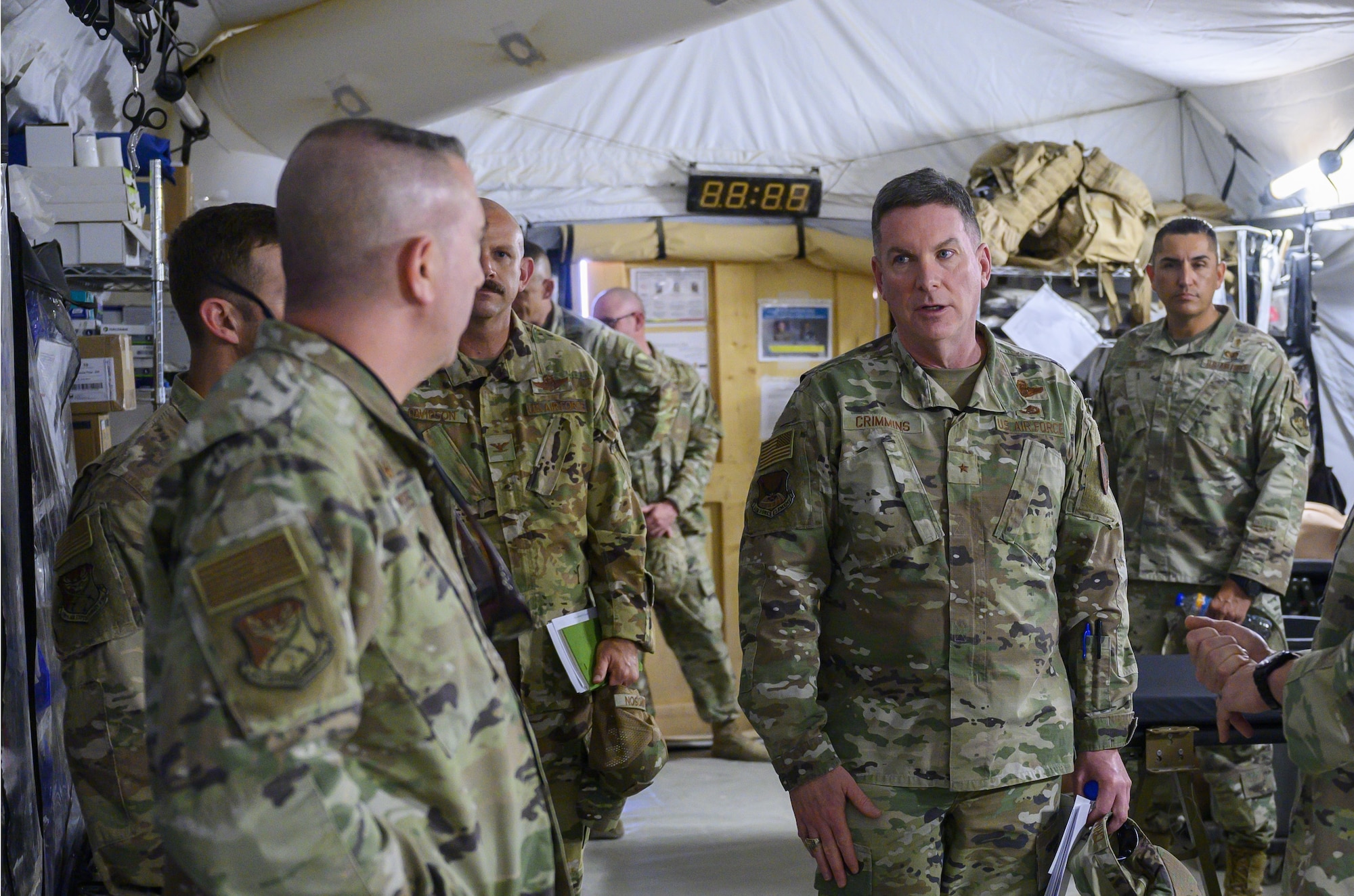 U.S. Air Force Brig. Gen. Thomas Crimmins, center, Senior Defense Official and Defense Attaché at the Embassy of the United States, Kingdom of Saudi Arabia, discusses the capabilities of the 378th Expeditionary Medical Group with senior base leadersat PSAB, KSA, Oct. 12, 2021. Crimmins visited PSAB for the first time since assuming the SDO role in September, meeting with various personnel to learn about defense efforts and expanding capabilities on base. (U.S. Air Force photo by Senior Airman Samuel Earick)