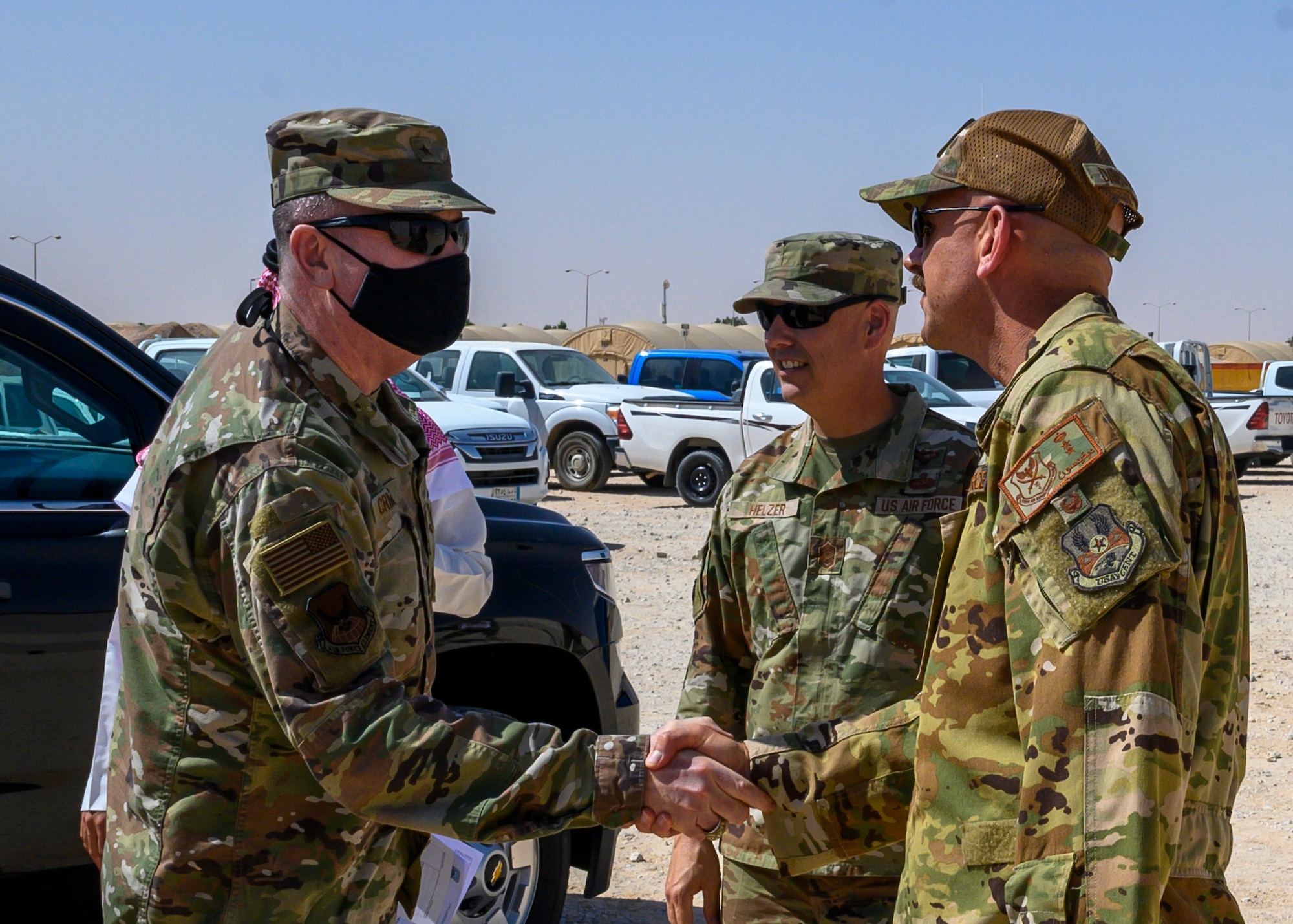 U.S. Air Force Col. Kevin Davidson, 378th Air Expeditionary Wing vice commander, greets U.S. Air Force Brig. Gen. Thomas Crimmins, Senior Defense Official and Defense Attaché at the Embassy of the United States, Kingdom of Saudi Arabia, at Prince Sultan Air Base, KSA, Oct. 12, 2021. Crimmins visited PSAB for the first time since assuming the SDO role in September, meeting with various personnel to learn about defense efforts and expanding capabilities on base. (U.S. Air Force photo by Senior Airman Samuel Earick)
