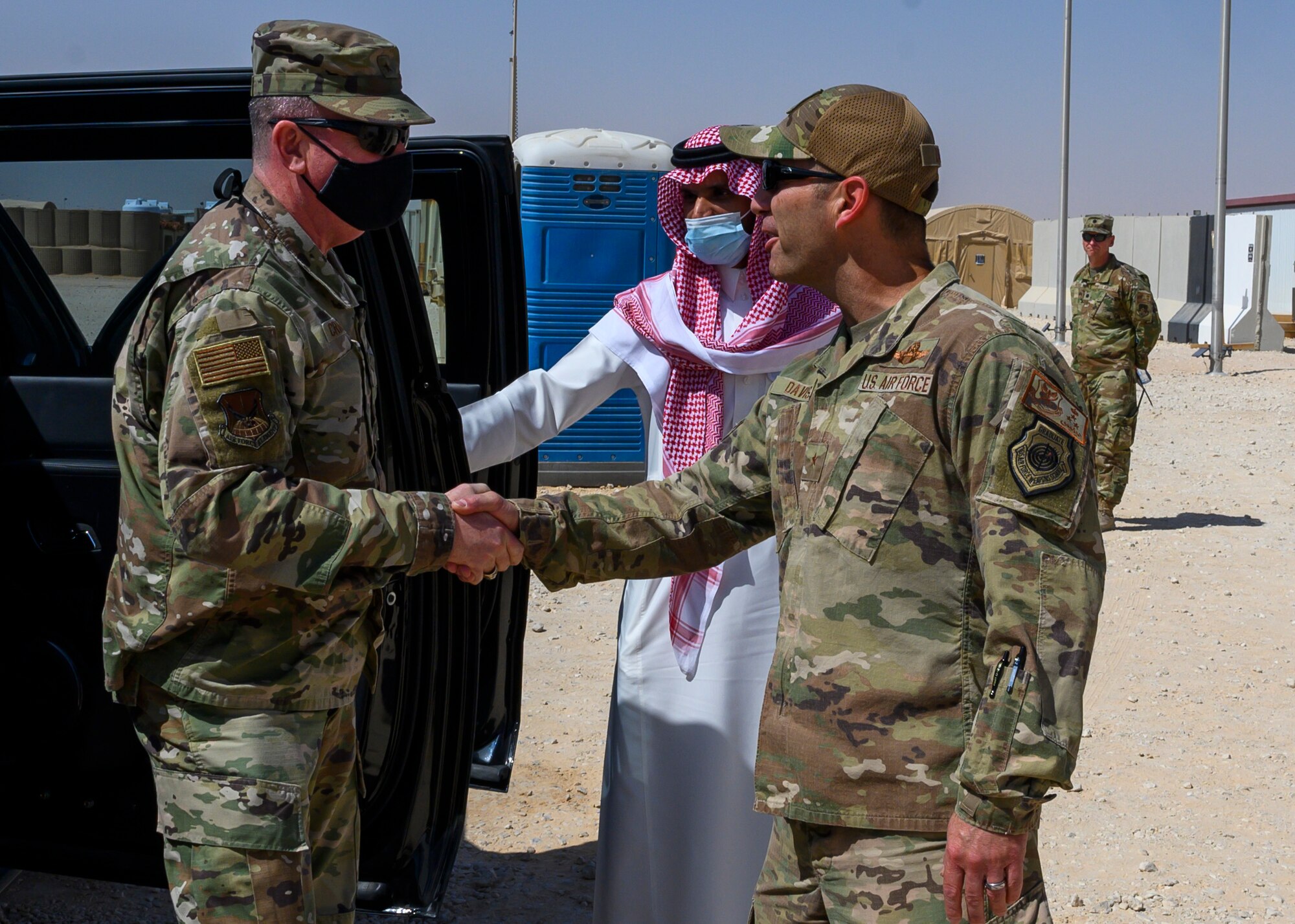 U.S. Air Force Brig. Gen. Robert Davis, 378th Air Expeditionary Wing commander, greets U.S. Air Force Brig. Gen. Thomas Crimmins, Senior Defense Official and Defense Attaché at the Embassy of the United States, Kingdom of Saudi Arabia, at Prince Sultan Air Base, KSA, Oct. 12, 2021. Crimmins visited PSAB for the first time since assuming the SDO role in September, meeting with various personnel to learn about defense efforts and expanding capabilities on base. (U.S. Air Force photo by Senior Airman Samuel Earick)