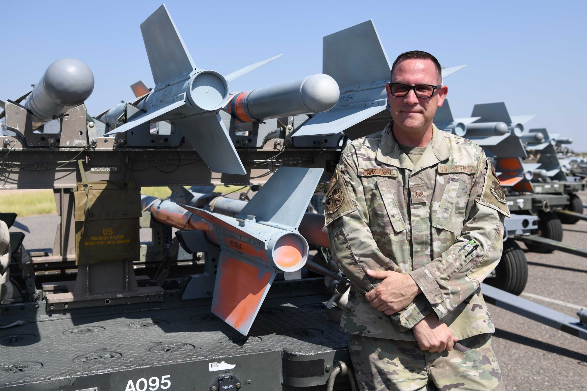 Luke Air Force Base, Ariz. -- Reserve Citizen Airman Staff Sgt. Stephen Zanzucchi, 944th Maintenance Squadron munitions support equipment maintenance crew chief, poses for a photo at Luke Air Force Base, Ariz., September 16, 2021. Zanzucchi was an elementary school teacher prior to joining the service and was inspired by his student’s to author six children’s book. (U.S. Air Force photo/Tech. Sgt. Courtney Richardson)