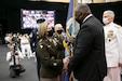 A man speaks during a ceremony.