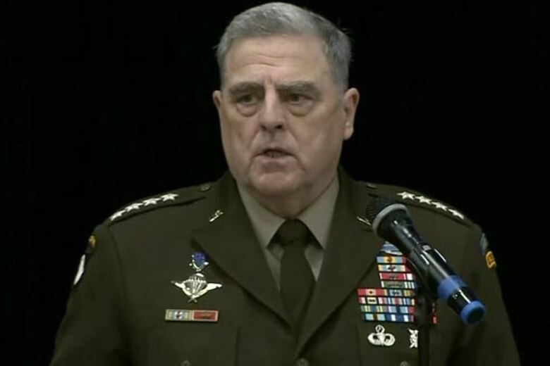 A man speaks during a ceremony.