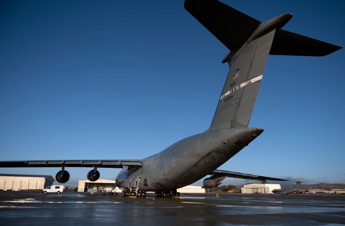 A C-5M Super Galaxy is parked on the flight line at Travis Air Force Base, Calif., Oct. 25, 2021. An aircrew of 13 service members assigned to the 22nd Airlift Squadron and the 60th Aircraft Maintenance Squadron, both specialized in C-5M procedure, departed Travis AFB traveling to Joint Base Charleston, S.C.