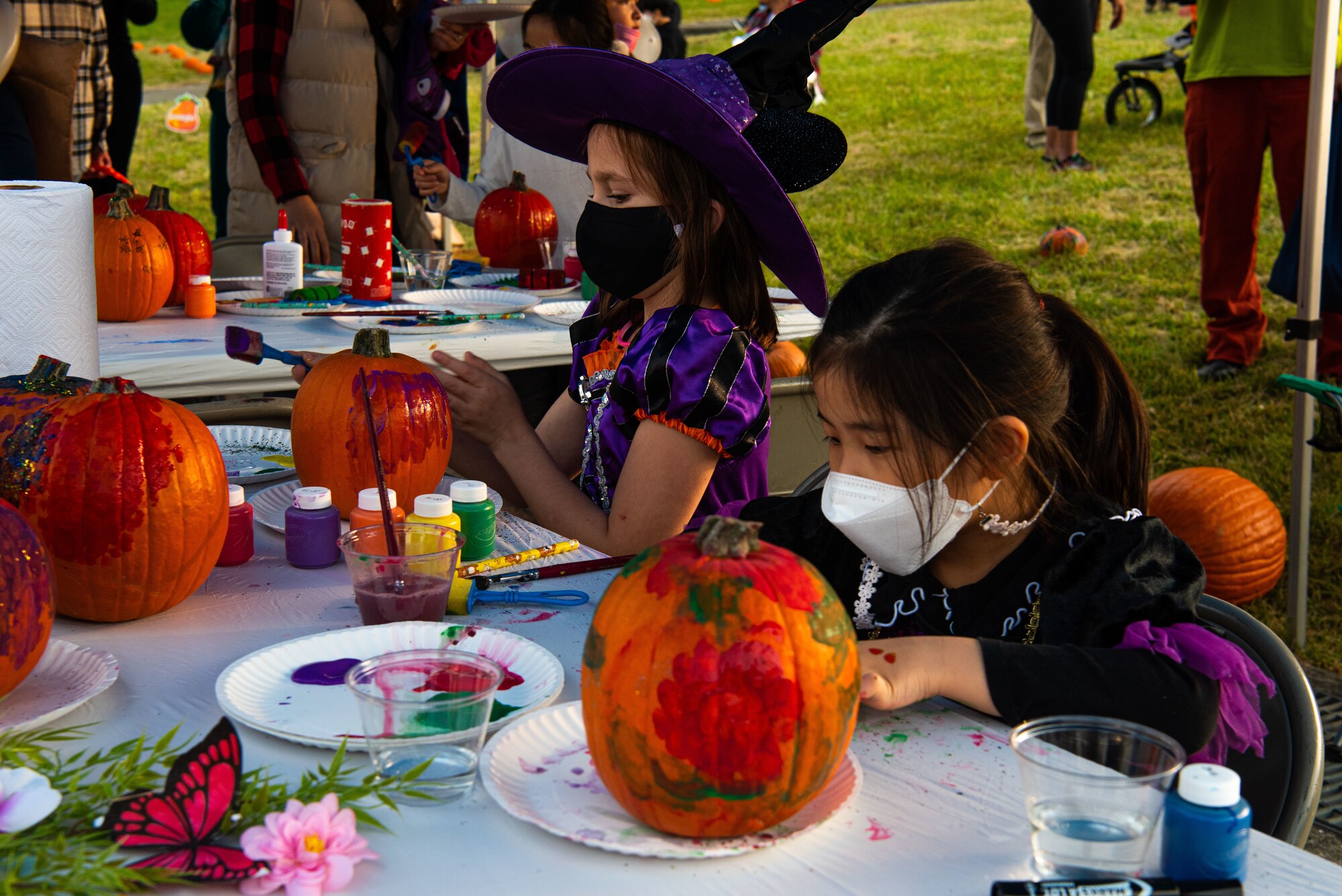 Children decorate pumpkins at a Fall Festival & Trunk or Treat event hosted and organized by the 51st Force Support Squadron Oct. 30, 2021, at Osan Air Base, Republic of Korea.
