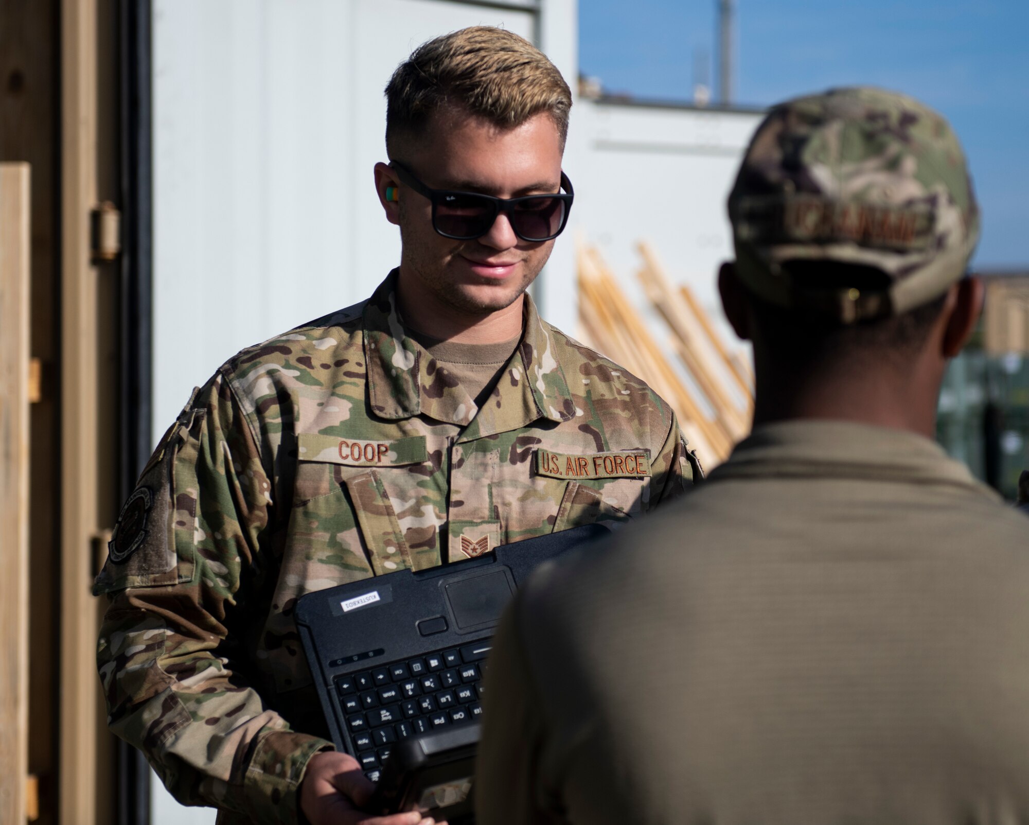 Staff Sgt. Owen Coop, 8th Maintenance Squadron stockpile management crew chief, left, and Senior Airman Rahman Buchanan, 8th MXS stockpile management technician, right, prepare to take inventory during munitions unloading at Kunsan Air Base, Republic of Korea, Oct. 29, 2021. The munitions team work year-round to posture the Wolf Pack with the latest munitions technologies so Kunsan is ready to fight tonight. (U.S. Air Force photo by Staff Sgt. Suzie Plotnikov)