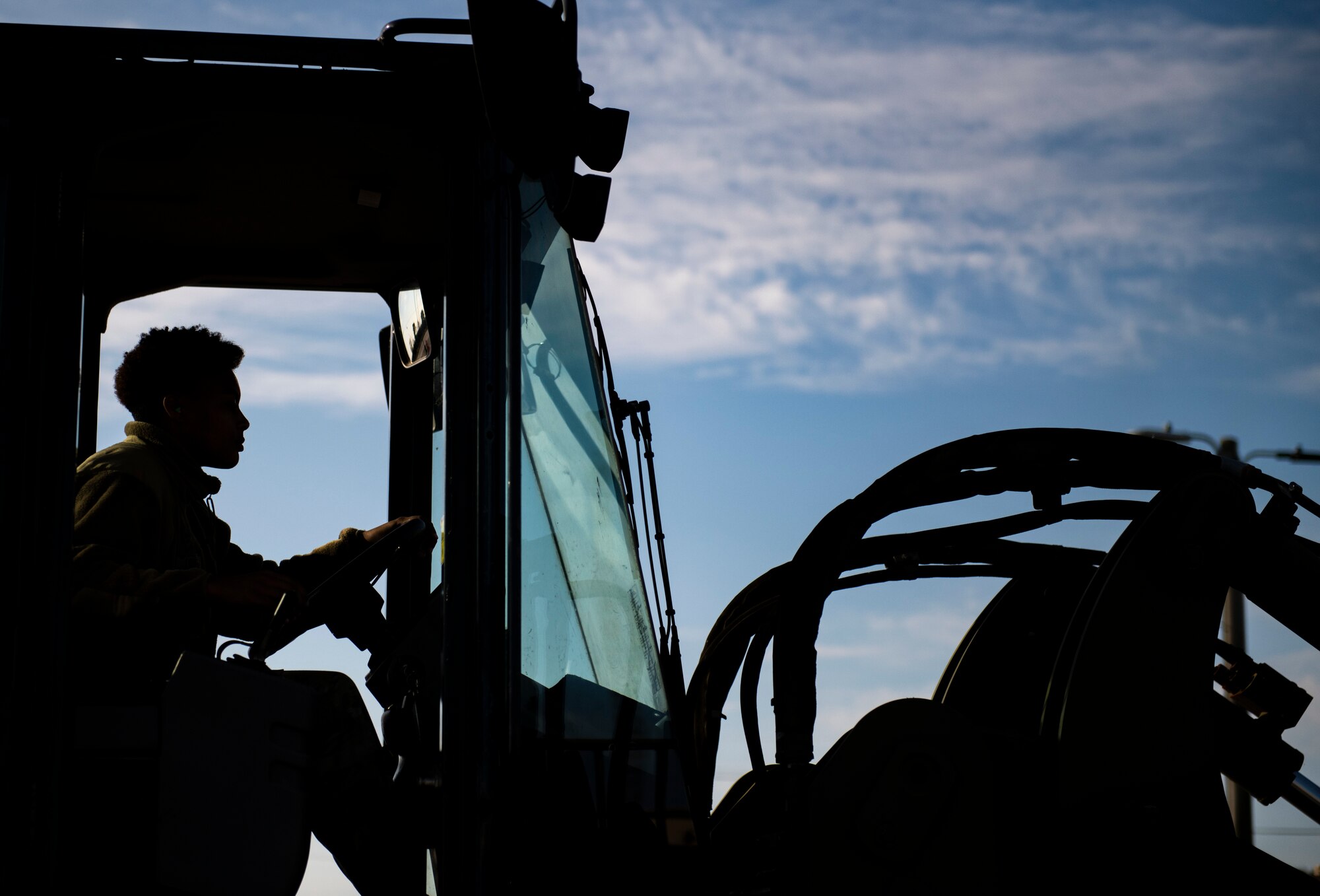 Airman 1st Class Mikala Correa, 8th Maintenance Squadron stockpile management technician, operates a forklift during a munitions unloading at Kunsan Air Base, Republic of Korea, Oct. 29, 2021. Munitions Airmen work with extreme care to handle, store, transport, arm and disarm weapons systems. (U.S. Air Force photo by Staff Sgt. Suzie Plotnikov)