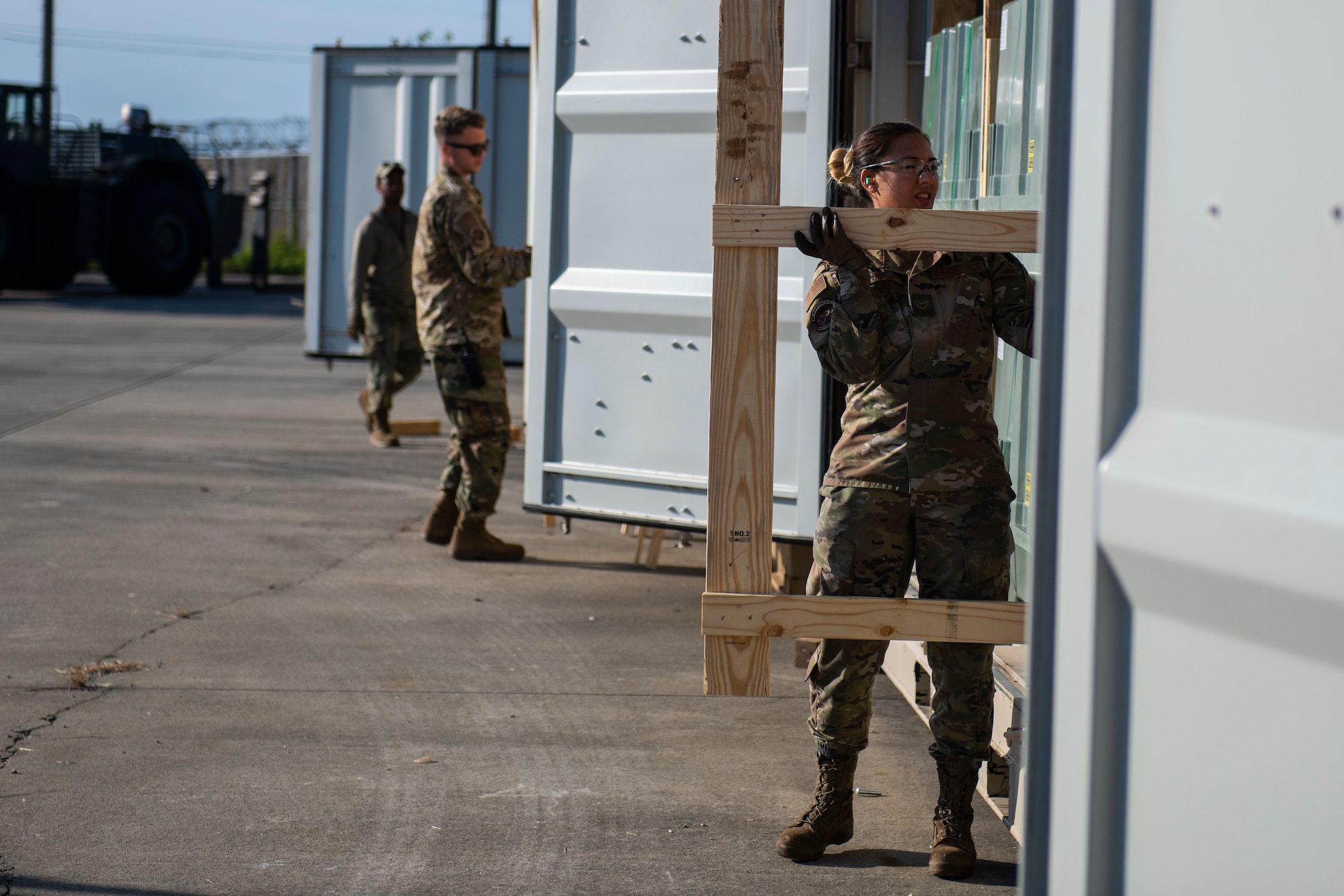 Stockpile management technicians prepare to move munitions at Kunsan Air Base, Republic of Korea, Oct. 29, 2021. The munitions team work year-round to posture the Wolf Pack with the latest munitions technologies, ensuring Kunsan is ready to fight tonight. (U.S. Air Force photo by Staff Sgt. Suzie Plotnikov)