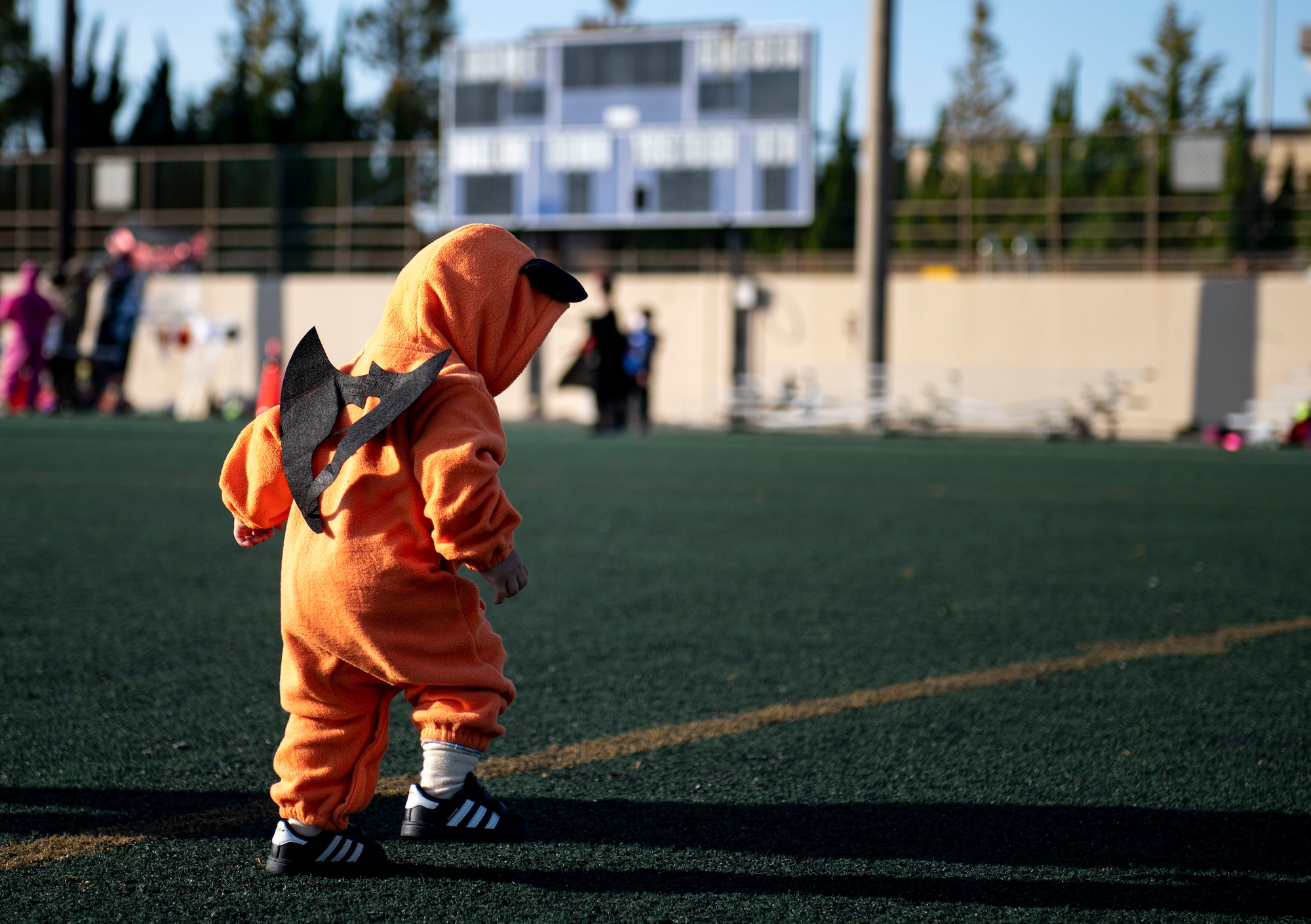 A Republic of Korea child runs through Kunsan’s soccer field during Kunsan’s Annual Halloween Trick-or-Treat at Kunsan Air Base, Republic of Korea, October, 28, 2021. The 8th Civil Engineer Squadron hosted this years event which was open to all U.S. Military and South Korean Nationals with base access. (U.S. Air Force photo by Staff Sgt. Jesenia Landaverde)