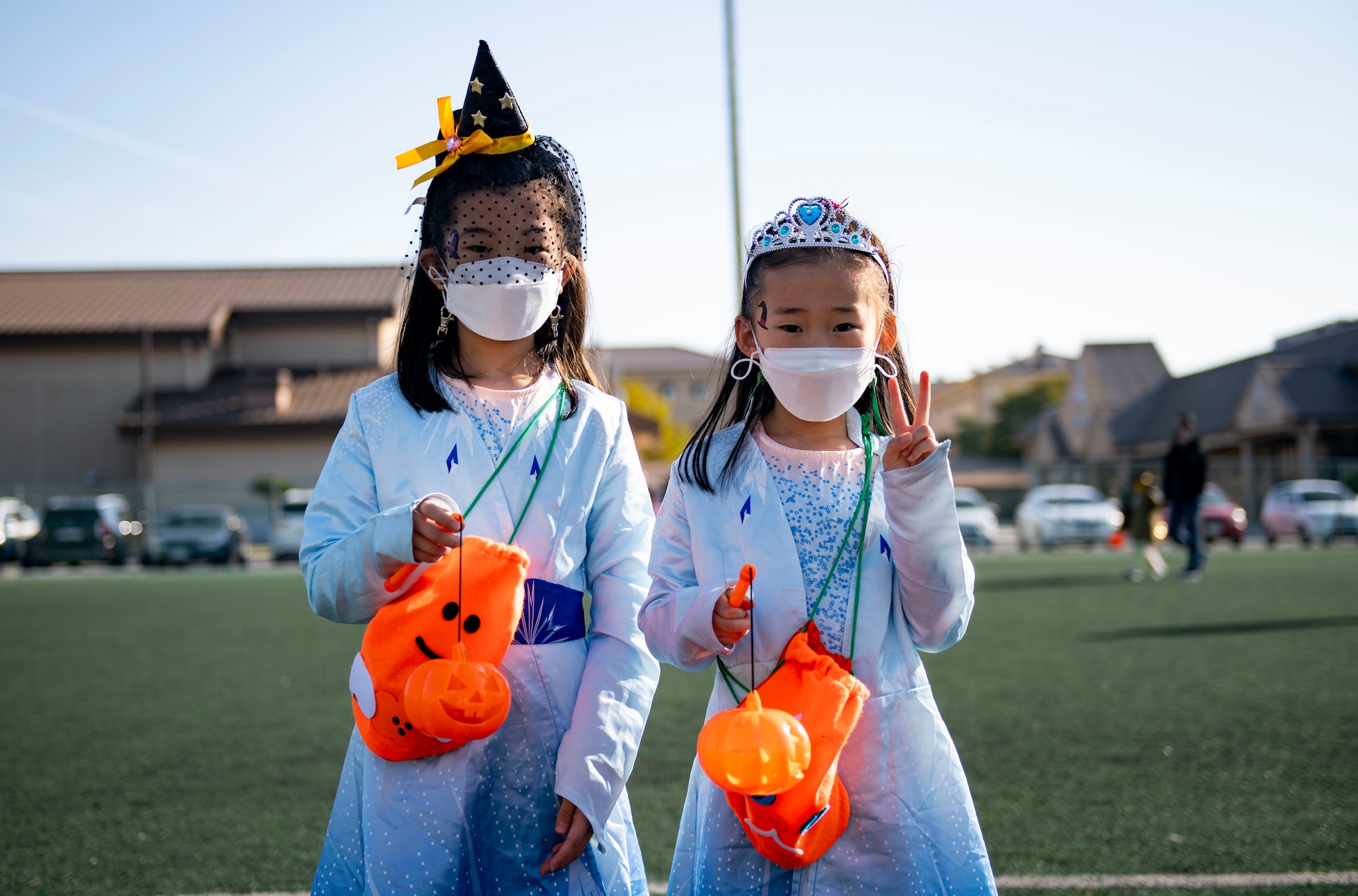 Republic of Korea national children dress up as Elsa, from the Disney movie Frozen, during Kunsan’s Annual Halloween Trick-or-Treat at Kunsan Air Base, Republic of Korea, October, 28, 2021. The 8th Civil Engineer Squadron hosted this years event which was open to all U.S. Military and South Korean Nationals with base access. (U.S. Air Force photo by Senior Airman Suzie Plotnikov)