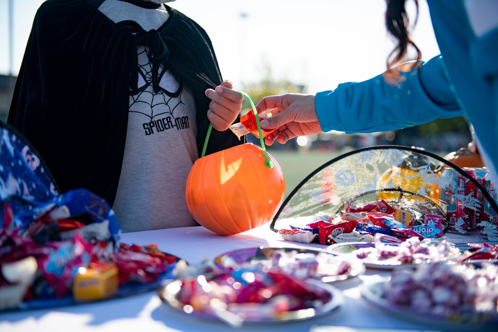 A festive carved pumpkin sits on the 8th Force Support Squadron candy booth during Kunsan’s Annual Halloween Trick-or-Treat at Kunsan Air Base, Republic of Korea, October, 28, 2021. The 8th Civil Engineer Squadron hosted this years event which was open to all U.S. Military and Republic of Korea nationals with base access. (U.S. Air Force photo by Senior Airman Suzanna Plotnikov)