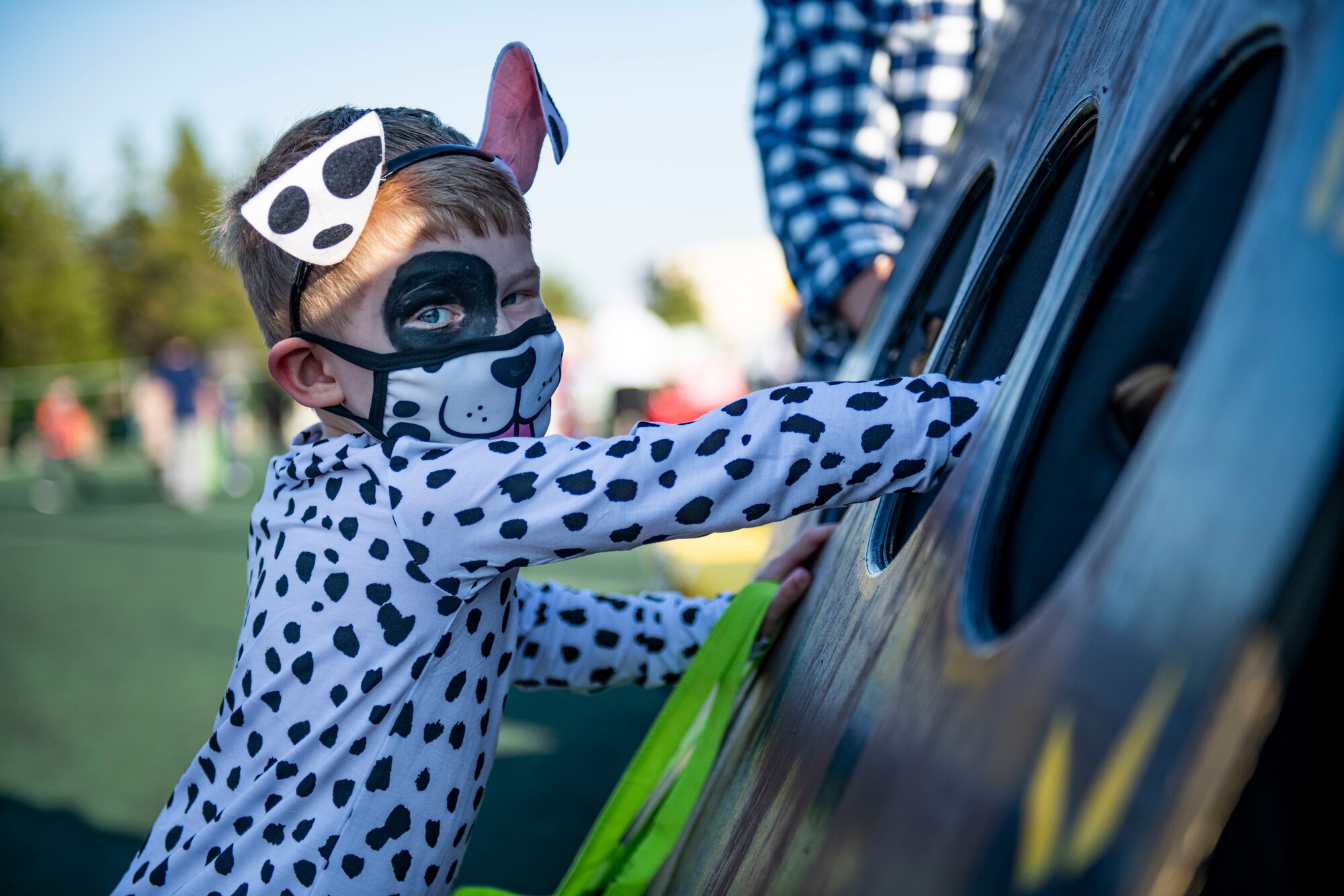 A U.S. Military child searches for candy through a mystery hole during Kunsan’s Annual Halloween Trick-or-Treat at Kunsan Air Base, Republic of Korea, October, 28, 2021. The 8th Civil Engineer Squadron hosted this years event which was open to all U.S. Military and South Korean Nationals with base access. (U.S. Air Force photo by Staff Sgt. Jesenia Landaverde)