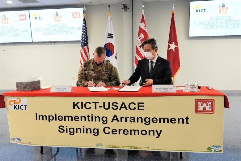 Brig. Gen. Kirk Gibbs (left), U.S. Army Corps of Engineers Pacific Ocean Division Commander and Dr. Kim Byung-suk (right), President of Korea Institute of Civil Engineering and Building Technology (KICT), signed an implementing arrangement, at the Far East District Headquarters, located on U.S. Army Garrison Humphreys, Aug. 27. The IA serves as direction on how USACE and KICT will work together to further develop mutual exchanges and technical cooperation.