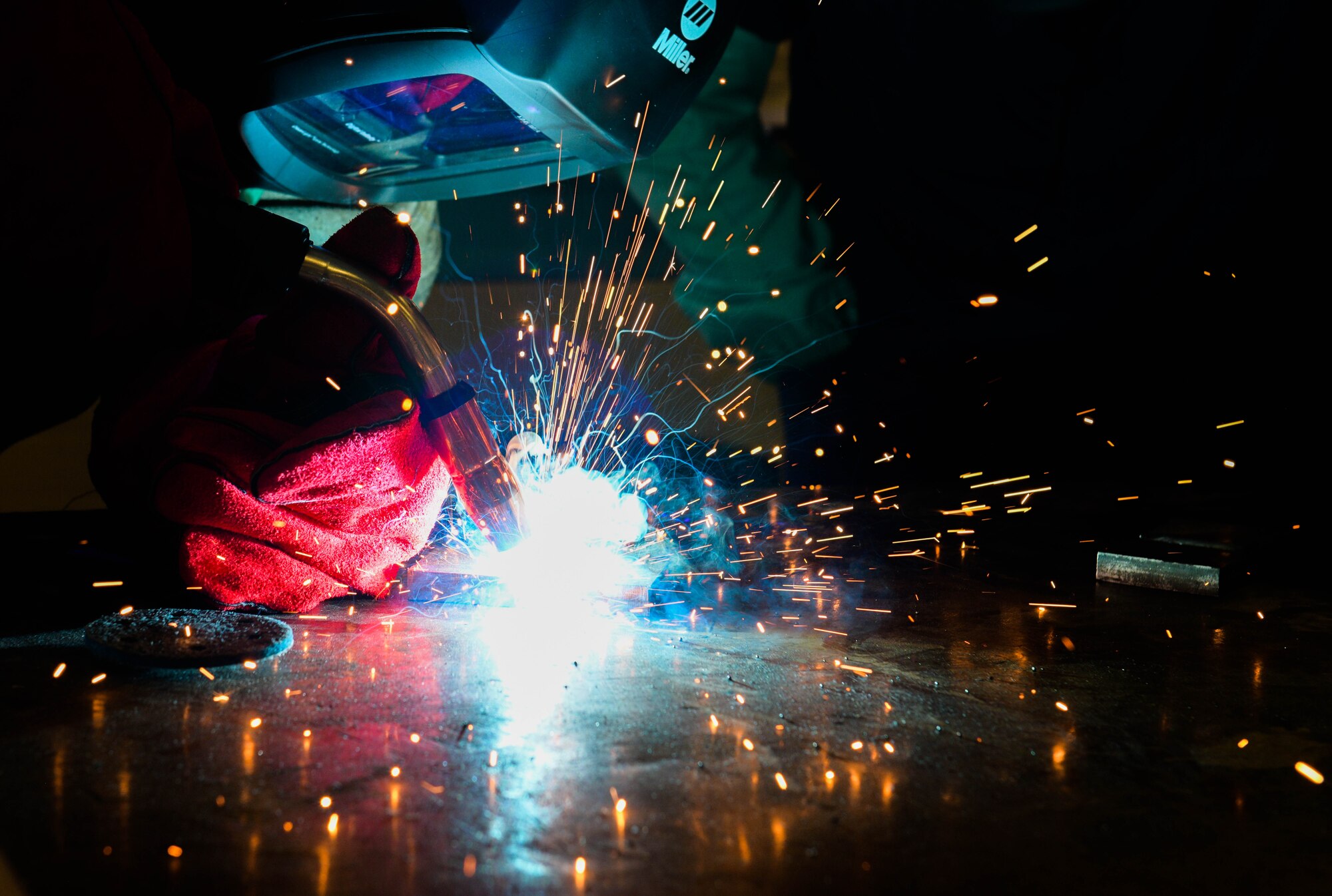 Senior Airman Joshuah Fonteno, 31st Maintenance Squadron metals technician journeyman, welds two pieces of metal together at Aviano Air Base, Italy, Aug. 30, 2021. Metal techs are responsible for welding and cutting raw material into usable forms to help repair and fabricate aircraft parts. (U.S. Air Force photo by Senior Airman Brooke Moeder)