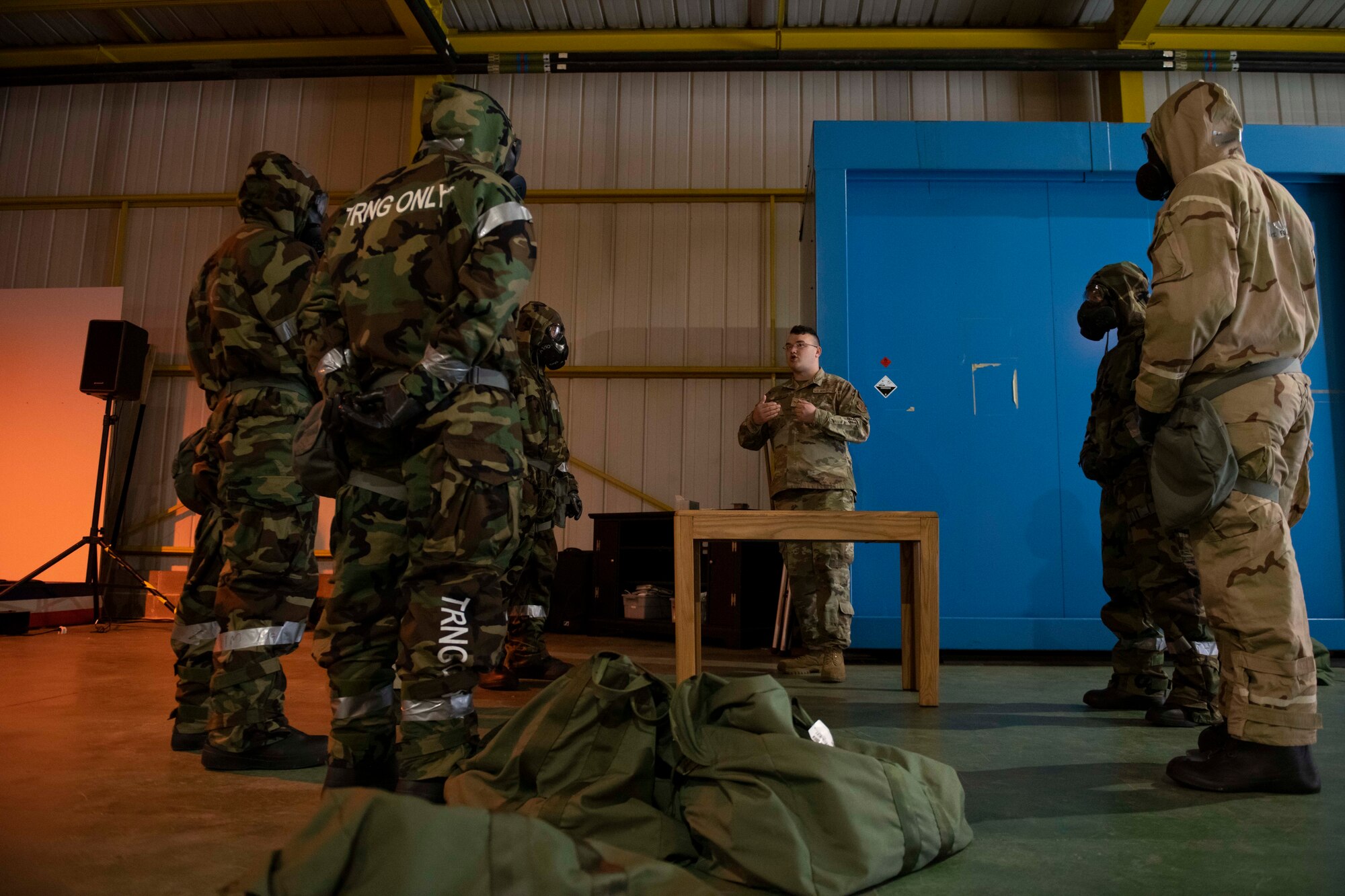 Airmen from the 501st Combat Support Wing receive a brief during Ability to Survive and Operate training at RAF Alconbury, England, Aug. 26, 2021. The ATSO rodeo was designed to reinforce Airmen’s ability to properly utilize their MOPP gear in a potential chemical environment. (U.S. Air Force photo by Senior Airman Jennifer Zima)