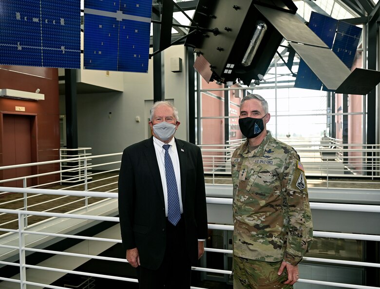 Secretary of the Air Force Frank Kendall stands with Lt. Gen. Stephen Whiting, commander of Space Operations Command, in front of a Space-Based Infrared System model at Peterson Space Force Base, Colo., Aug. 18, 2021. During his first visit to Peterson SFB, Kendall met with U.S. Space Command, U.S. Northern Command and SpOC leadership, as well as Airmen and Guardians to recognize their roles in protecting the nation. (U.S. Air Force photo by Wayne Clark)
