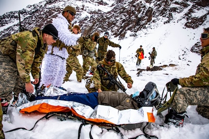 U.S. Army Soldiers assigned to Bravo Company, 2nd Battalion, 87th Infantry Regiment, 2nd Brigade Combat Team, 10th Mountain Division, and Chilean army soldiers assigned to 3rd Mountain Division, conduct a mock-rescue operation in Portillo, Chile Aug. 27, 2021. Soldiers learned the basics of cold weather, mountain warfare including survival, movement and combat fundamentals as part of the Southern Vanguard 2021 exercise between U.S. and Chilean soldiers. (U.S. Army photo by Joshua Taeckens)