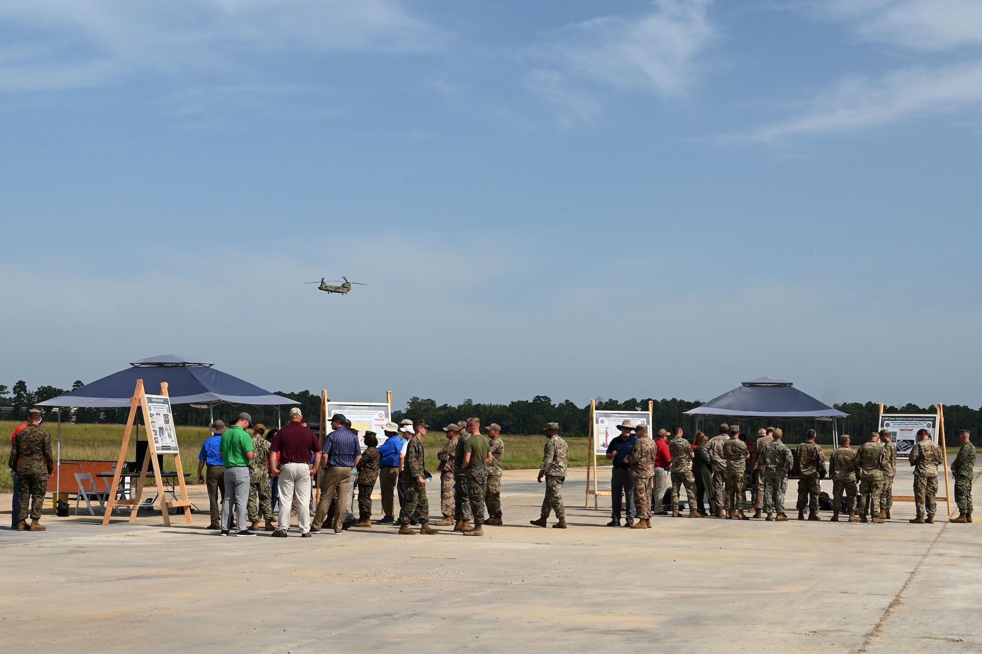 U.S. Air Force civil engineers from the pavements and construction equipment career field, from eight separate units, team up with U.S. Navy Seabees from the Naval Mobile Construction Battalion 133, Gulfport, Mississippi for an Expedient and Expeditionary Airfield Damage Repair (E-ADR) distinguished visitors’ demonstration at McEntire Joint National Guard Base, South Carolina, Aug. 31, 2021. The purpose of the training is to provide just enough, just in time repair capability with minimal cost and materials in a wartime situation.  (U.S. Air National Guard photo by Senior Master Sgt. Edward Snyder, 169th Fighter Wing Public Affairs)