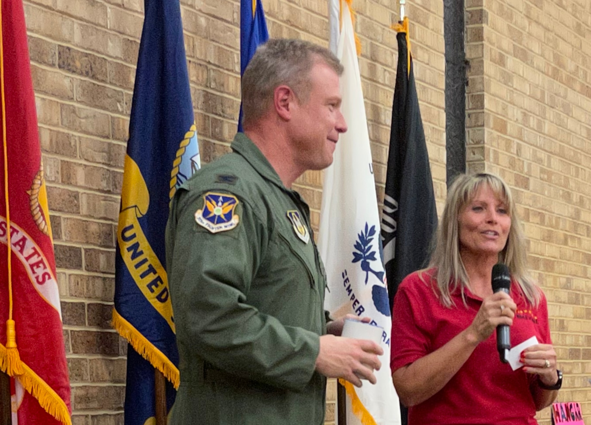 (left) 301st Fighter Wing Commander Col. Allen Duckworth receives a Roll Call coffee mug from Roll Call volunteer, Senior Master Sgt. (ret.) and former 301 FW member Mary Staffeld after speaking at Roll Call Fort Worth's monthly luncheon event held on August 27, 2021 in Fort Worth, Texas. Roll Call's mission is "to honor and serve their local veterans by providing a regular venue for fellowship and camaraderie, providing outreach and home visitation services, and sharing the stories of their local veterans through community engagements and publication." (U.S. Air Force photos by Capt. Jessica Gross) 
*No Federal Endorsement Implied*
