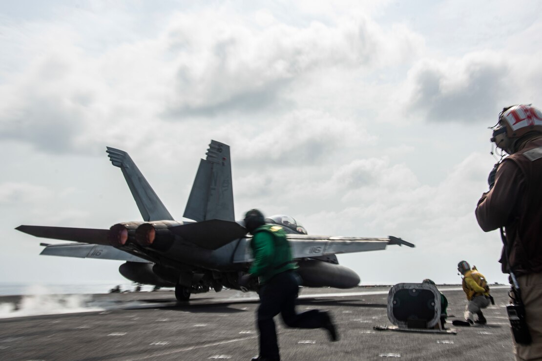 An F/A-18F Super Hornet fighter jet, attached to the “Diamondbacks” of Strike Fighter Squadron (VFA) 102, launches from the flight deck of the aircraft carrier USS Ronald Reagan (CVN 76) in the Arabian Sea.