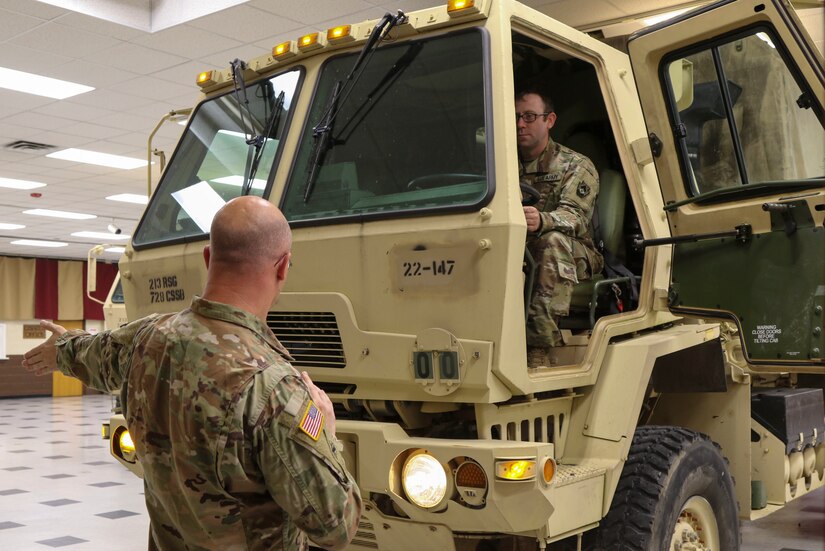 Spc. Justin Love, a utilities equipment repairer and Sgt. Joshua Watkins, a construction equipment repairer, both with the 3622nd Support Maintenance Company, 728th Combat Sustainment Support Battalion, 213th Regional Support Group, Pennsylvania Army National Guard, check the lights on one of the eight high-clearance vehicles their unit has readied to respond to Tropical Storm Ida Sept. 1 at Fort Indiantown Gap. About 120 Pennsylvania National Guard members total with approximately 35 vehicles have been placed on state active duty and are on stand-by as Ida bears down on Pennsylvania. (U.S. Army National Guard photo by Staff Sgt. Zane Craig)