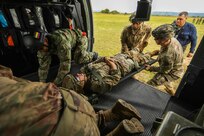 U.S. Army medics assigned to 2nd battalion, 501st Parachute Infantry Regiment, 1st Brigade Combat Team, 82nd Airborne Division and a Colombian army combat medic conduct medical rehearsals in preparation for a combined airborne exercise July 24, 2021, at Tolemaida Air Base, Colombia. The U.S. Army and Colombia joint military carried out a Dynamic Force Employment airborne exercise, also known as Exercise Hidra II, involving jungle and water survival training, multiple airborne jumps and a field training exercise. (Photo by Pfc. Joshua Taeckens)