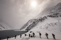 U.S. Army 10th Mountain Division Soldiers, alongside their Chilean Army partners, cross-country ski during Exercise Southern Vanguard 2021 (SV21) near Portillo Lake Portillo, Chile, Aug. 24, 2021. Developed by U.S. Army South, SV21 is a two-week combined high altitude, cold weather training exercise between U.S. and Chilean army forces to increase collaboration, enhance interoperability, and assist in building partner nation capacity. (U.S. Army photos by Pfc. Joshua Taeckens)