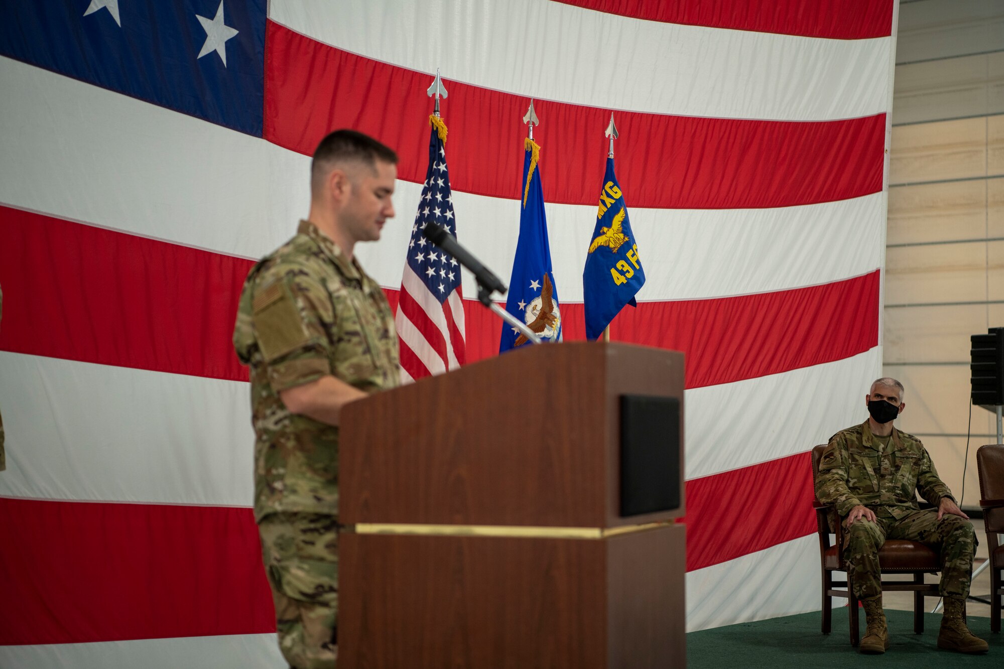 man stands at podium