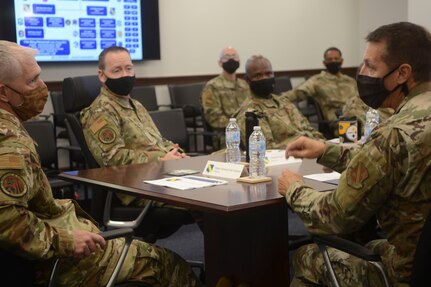From right, U.S. Air Force Maj. Gen. Joel Jackson, Air Force District of Washington commander; Chief Master Sgt. Leon Calloway, AFDW command chief; Lt. Col. Robert Kline, AFDW executive officer; and Col. Paul Filcek, AFDW deputy commander, listen to Senior Airman Jose DeJesus-Bermudez, 11th Security Forces Squadron, inside the gate guard shack at Joint Base Anacostia-Bolling, Washington, D.C., Aug. 25, 2021. The AFDW command team visited various sections of the wing and select base mission partners during a two-day immersion tour to listen, learn, take questions, and recognize the achievements of unit Airmen and mission partners. (U.S. Air Force photo by Benjamin Matwey)