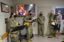 From right, U.S. Air Force Maj. Gen. Joel Jackson, Air Force District of Washington commander; Chief Master Sgt. Leon Calloway, AFDW command chief; Lt. Col. Robert Kline, AFDW executive officer; and Col. Paul Filcek, AFDW deputy commander, listen to Senior Airman Jose DeJesus-Bermudez, 11th Security Forces Squadron, inside the gate guard shack at Joint Base Anacostia-Bolling, Washington, D.C., Aug. 25, 2021. The AFDW command team visited various sections of the wing and select base mission partners during a two-day immersion tour to listen, learn, take questions, and recognize the achievements of unit Airmen and mission partners. (U.S. Air Force photo by Benjamin Matwey)