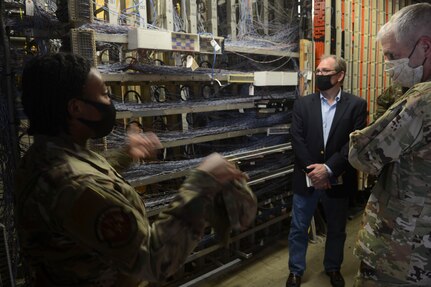 From right, U.S. Air Force Maj. Gen. Joel Jackson, Air Force District of Washington commander; Chief Master Sgt. Leon Calloway, AFDW command chief; Lt. Col. Robert Kline, AFDW executive officer; and Col. Paul Filcek, AFDW deputy commander, listen to Senior Airman Jose DeJesus-Bermudez, 11th Security Forces Squadron, inside the gate guard shack at Joint Base Anacostia-Bolling, Washington, D.C., Aug. 25, 2021. The AFDW command team visited various sections of the wing and select base mission partners during a two-day immersion tour to listen, learn, take questions, and recognize the achievements of unit Airmen and mission partners. (U.S. Air Force photo by Benjamin Matwey)