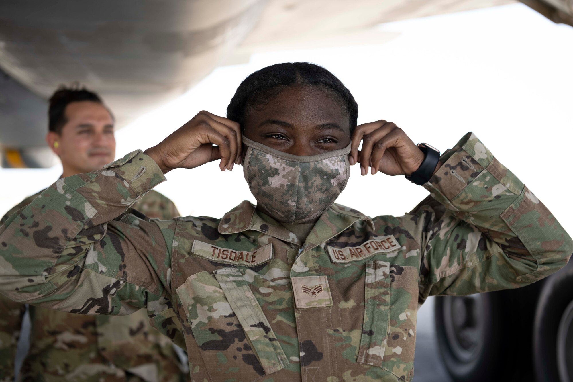 An Airman puts ear foams on