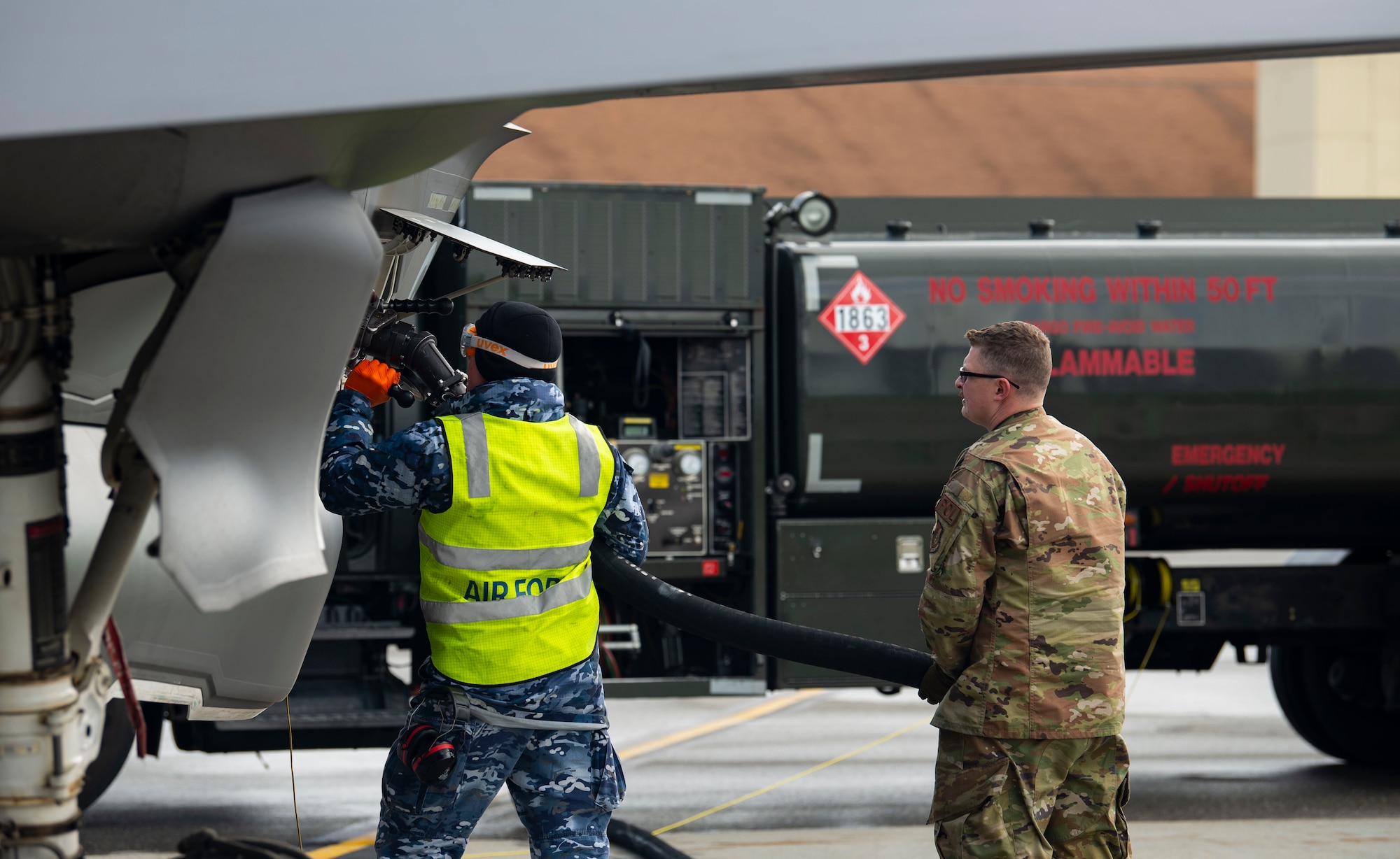 A Royal Australian Air Force (RAAF) aircraft maintainer and a U.S. Air Force (USAF) Airman assigned to the 354th Logistics Readiness Squadron refuel an F-35A Lightning II during RED FLAG-Alaska 21-3 on Eielson Air Force Base, Alaska, Aug. 20, 2021. The RAAF and USAF have similar visions and came together to deepen relationships and strengthen engagements, which allows both nations to deliver air and space power to the Indo-Pacific region as part of a multinational joint force. (U.S. Air Force photo by Senior Airman Beaux Hebert)